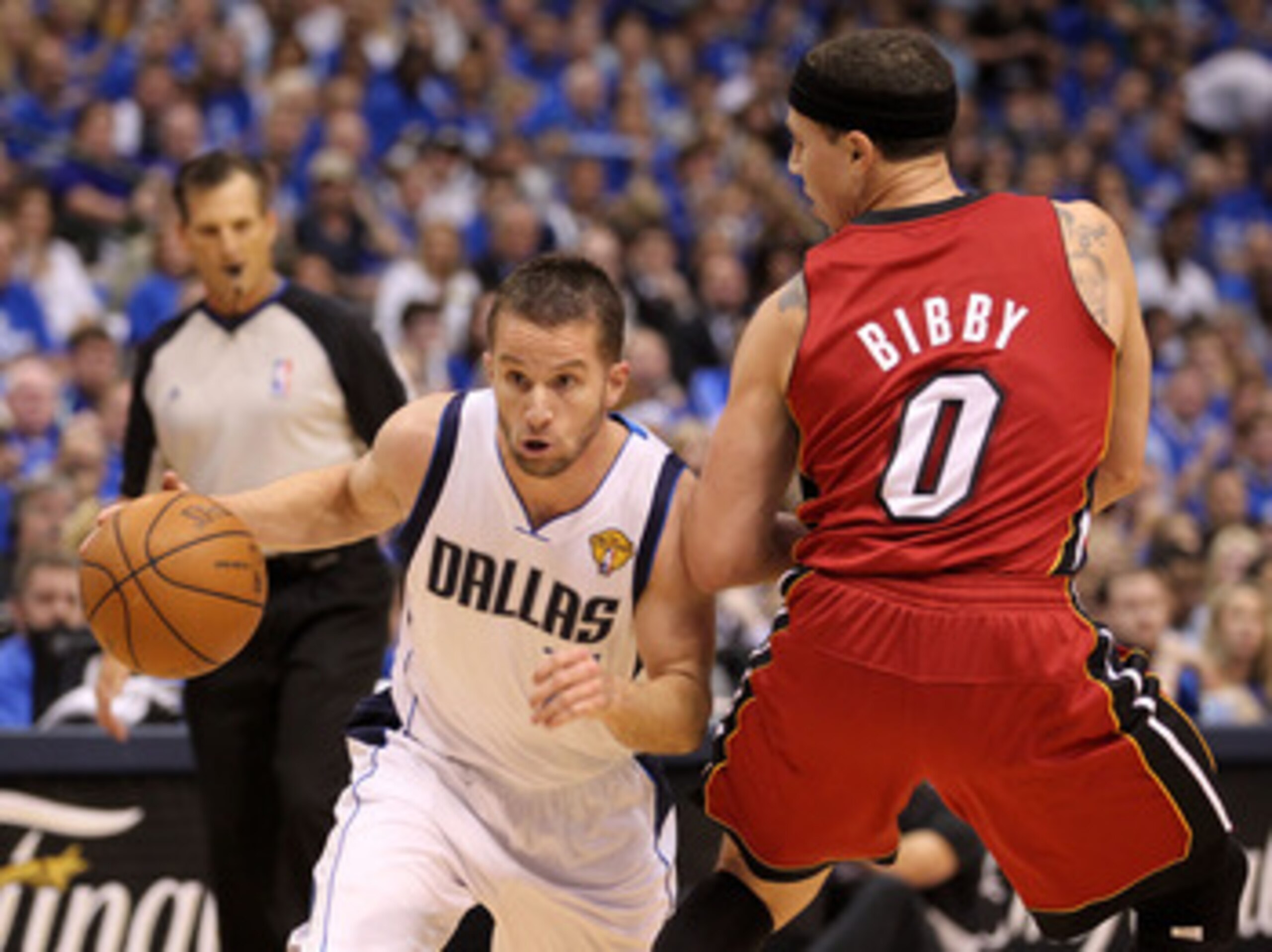 DALLAS, TX - JUNE 07:  Jose Juan Barea #11 of the Dallas Mavericks drives against Mike Bibby #0 of the Miami Heat in Game Four of the 2011 NBA Finals at American Airlines Center on June 7, 2011 in Dallas, Texas. NOTE TO USER: User expressly acknowledges a
