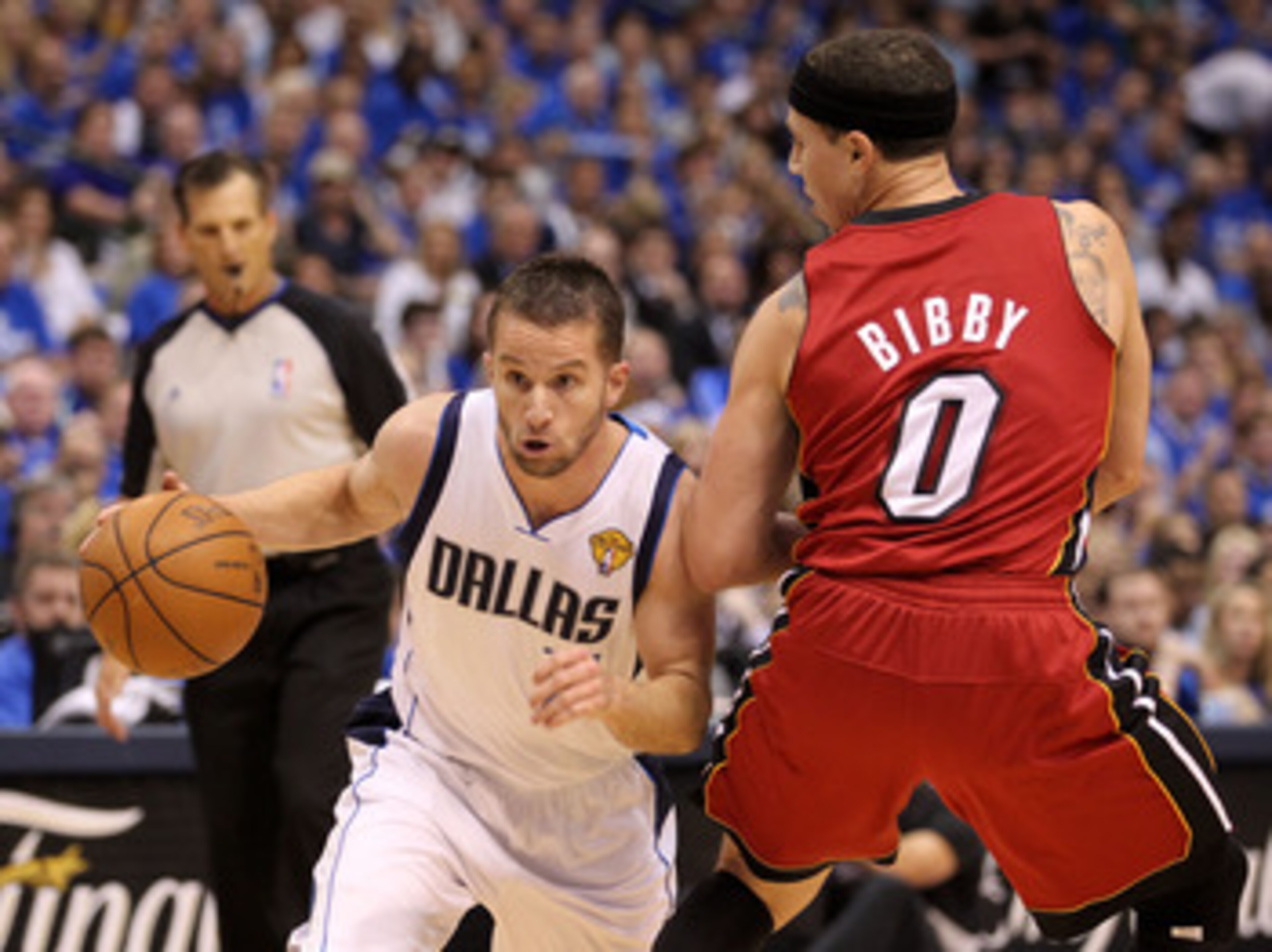 DALLAS, TX - JUNE 07:  Jose Juan Barea #11 of the Dallas Mavericks drives against Mike Bibby #0 of the Miami Heat in Game Four of the 2011 NBA Finals at American Airlines Center on June 7, 2011 in Dallas, Texas. NOTE TO USER: User expressly acknowledges a