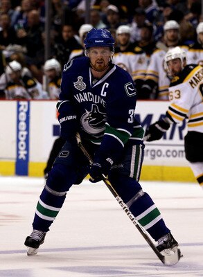 VANCOUVER, BC - JUNE 01:  Henrik Sedin #33 of the Vancouver Canucks in against the Boston Bruins during game one of the 2011 NHL Stanley Cup Finals at Rogers Arena on June 1, 2011 in Vancouver, Canada.  (Photo by Bruce Bennett/Getty Images)