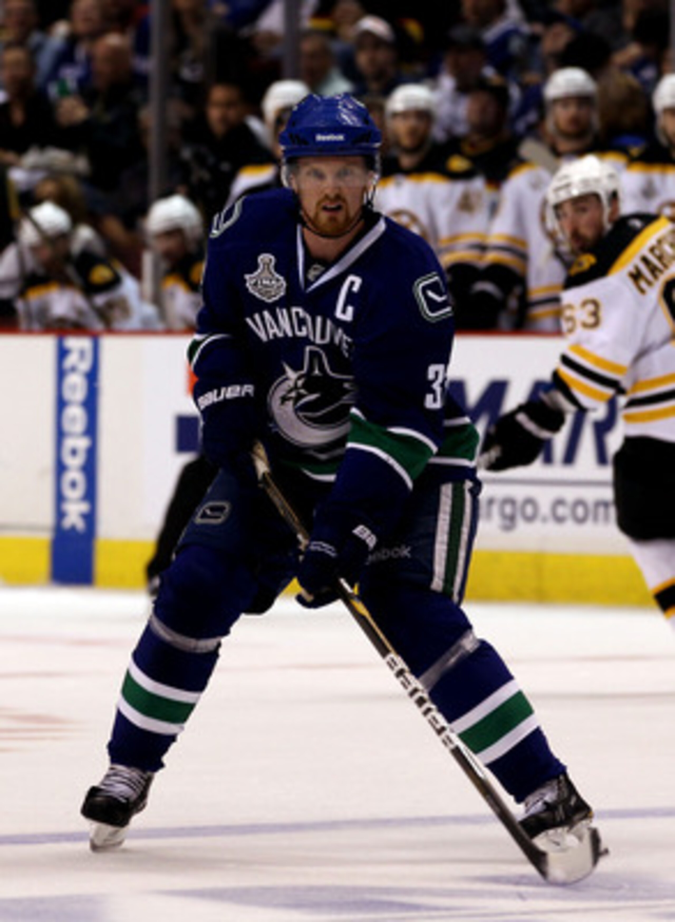 VANCOUVER, BC - JUNE 01:  Henrik Sedin #33 of the Vancouver Canucks in against the Boston Bruins during game one of the 2011 NHL Stanley Cup Finals at Rogers Arena on June 1, 2011 in Vancouver, Canada.  (Photo by Bruce Bennett/Getty Images)