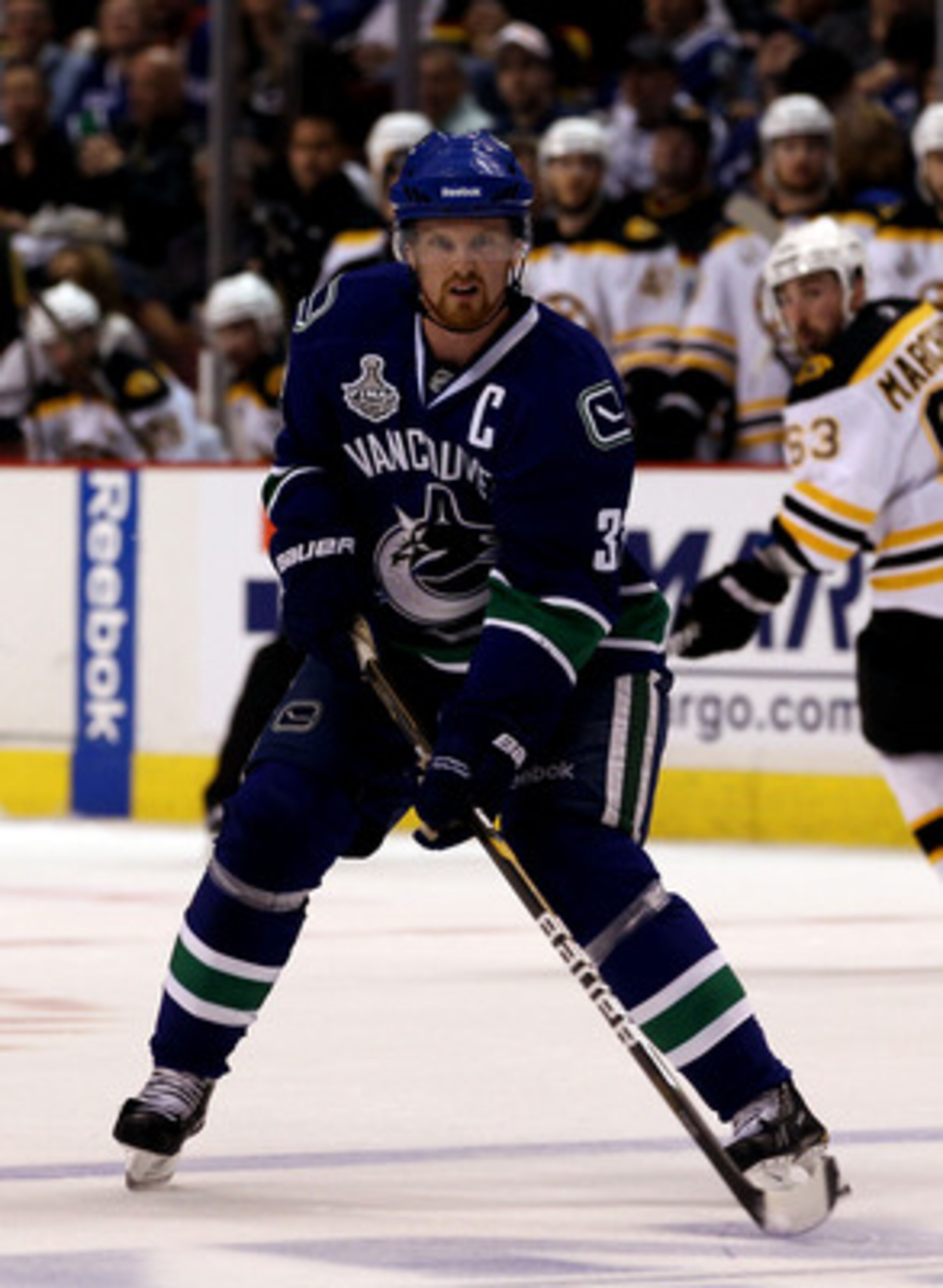 VANCOUVER, BC - JUNE 01:  Henrik Sedin #33 of the Vancouver Canucks in against the Boston Bruins during game one of the 2011 NHL Stanley Cup Finals at Rogers Arena on June 1, 2011 in Vancouver, Canada.  (Photo by Bruce Bennett/Getty Images)