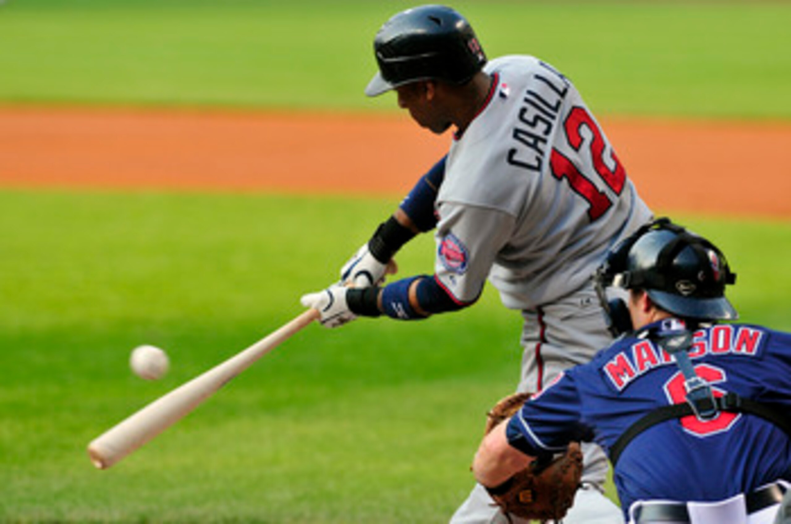 CLEVELAND, OH - JUNE 7: Alexi Casilla #12 of the Minnesota Twins bats during the first inning with Lou Marson #6 of the Cleveland Indians catching at Progressive Field on June 7, 2011 in Cleveland, Ohio. (Photo by Jason Miller/Getty Images) CLEVELAND, OH - JUNE 7: Alexi Casilla #12 of the Minnesota Twins bats during the first inning with Lou Marson #6 of the Cleveland Indians catching at Progressive Field on June 7, 2011 in Cleveland, Ohio. (Photo by Jason Miller/Getty Images)