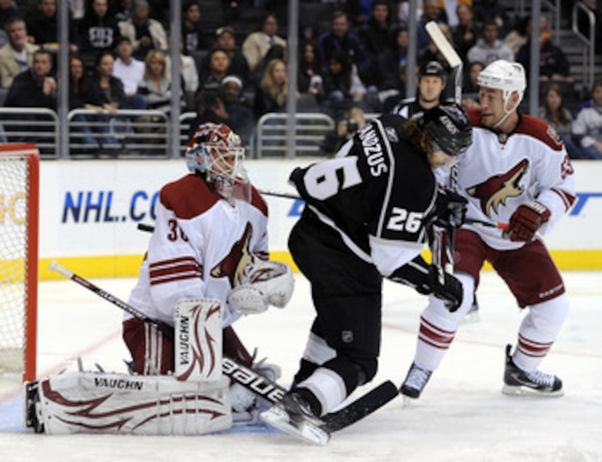 LOS ANGELES, CA - JANUARY 20:  Ilya Bryzgalov #30 of the Phoenix Coyotes makes a save in front of Michal Handzus #26 of the Los Angeles Kings and Derek Morris #53 at the Staples Center on January 20, 2011 in Los Angeles, California.  (Photo by Harry How/G