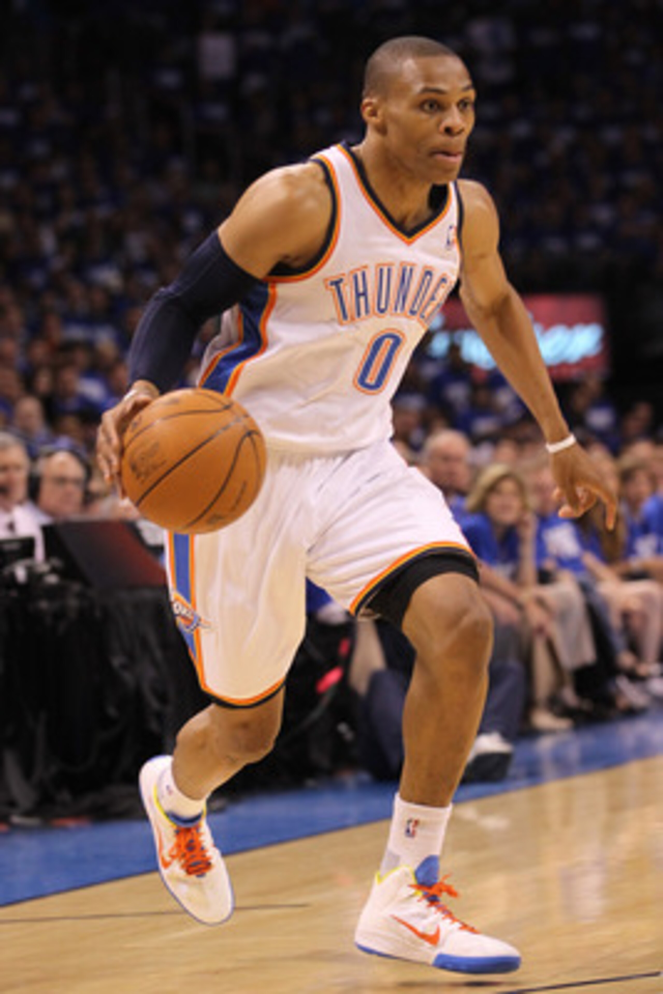 OKLAHOMA CITY, OK - MAY 21: Russell Westbrook #0 of the Oklahoma City Thunder moves the ball while taking on the Dallas Mavericks in Game Three of the Western Conference Finals during the 2011 NBA Playoffs at Oklahoma City Arena on May 21, 2011 in Oklaho OKLAHOMA CITY, OK - MAY 21: Russell Westbrook #0 of the Oklahoma City Thunder moves the ball while taking on the Dallas Mavericks in Game Three of the Western Conference Finals during the 2011 NBA Playoffs at Oklahoma City Arena on May 21, 2011 in Oklaho