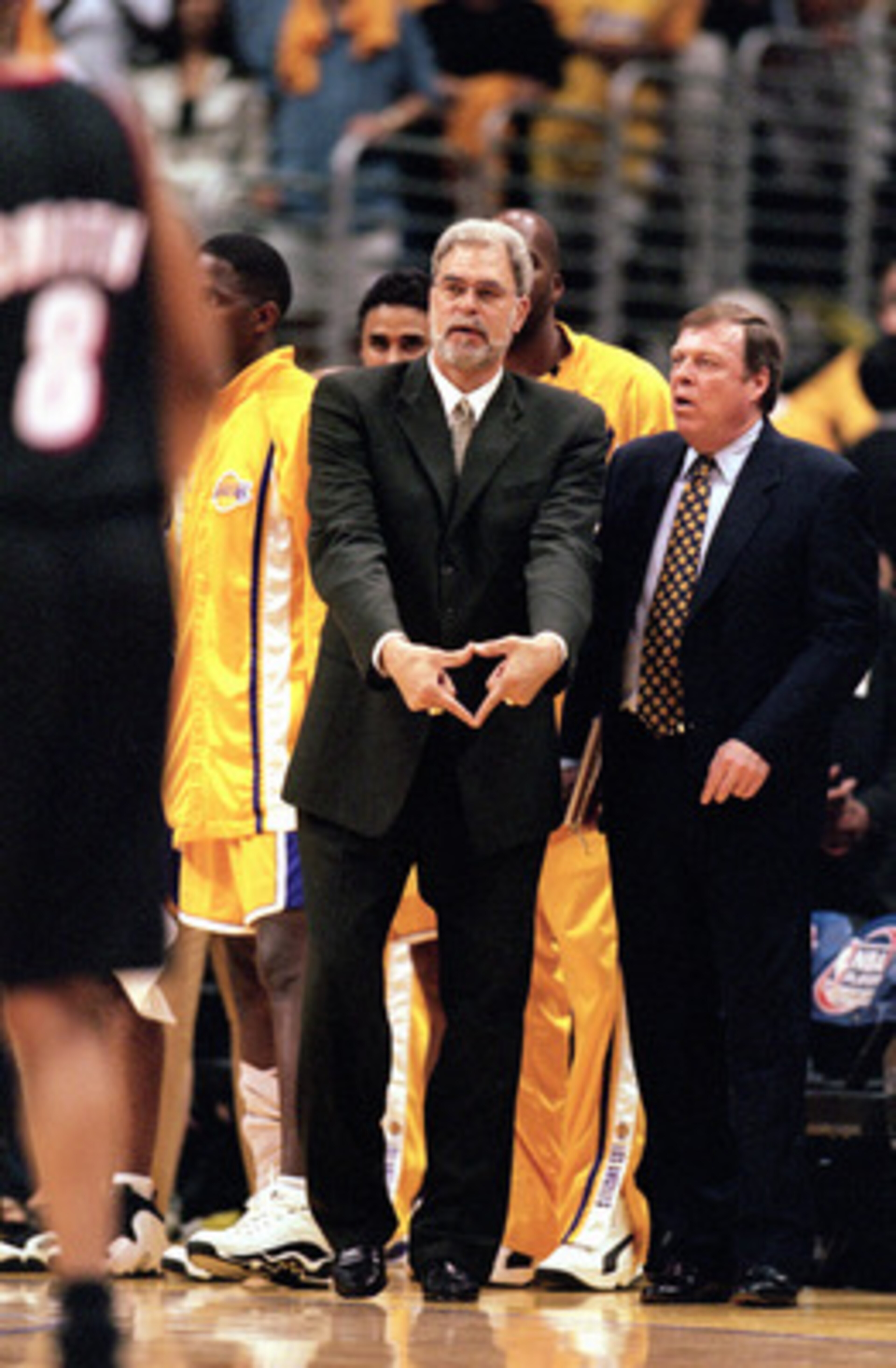 LOS ANGELES - JUNE 4: Head coach Phil Jackson of the Los Angeles Lakers signals triangle defense as assistant coach Frank Hamblen looks on during Game 7 of the Western Conference Finals against the Portland Trail Blazers at Staples Center on June 4, 2000 LOS ANGELES - JUNE 4: Head coach Phil Jackson of the Los Angeles Lakers signals triangle defense as assistant coach Frank Hamblen looks on during Game 7 of the Western Conference Finals against the Portland Trail Blazers at Staples Center on June 4, 2000