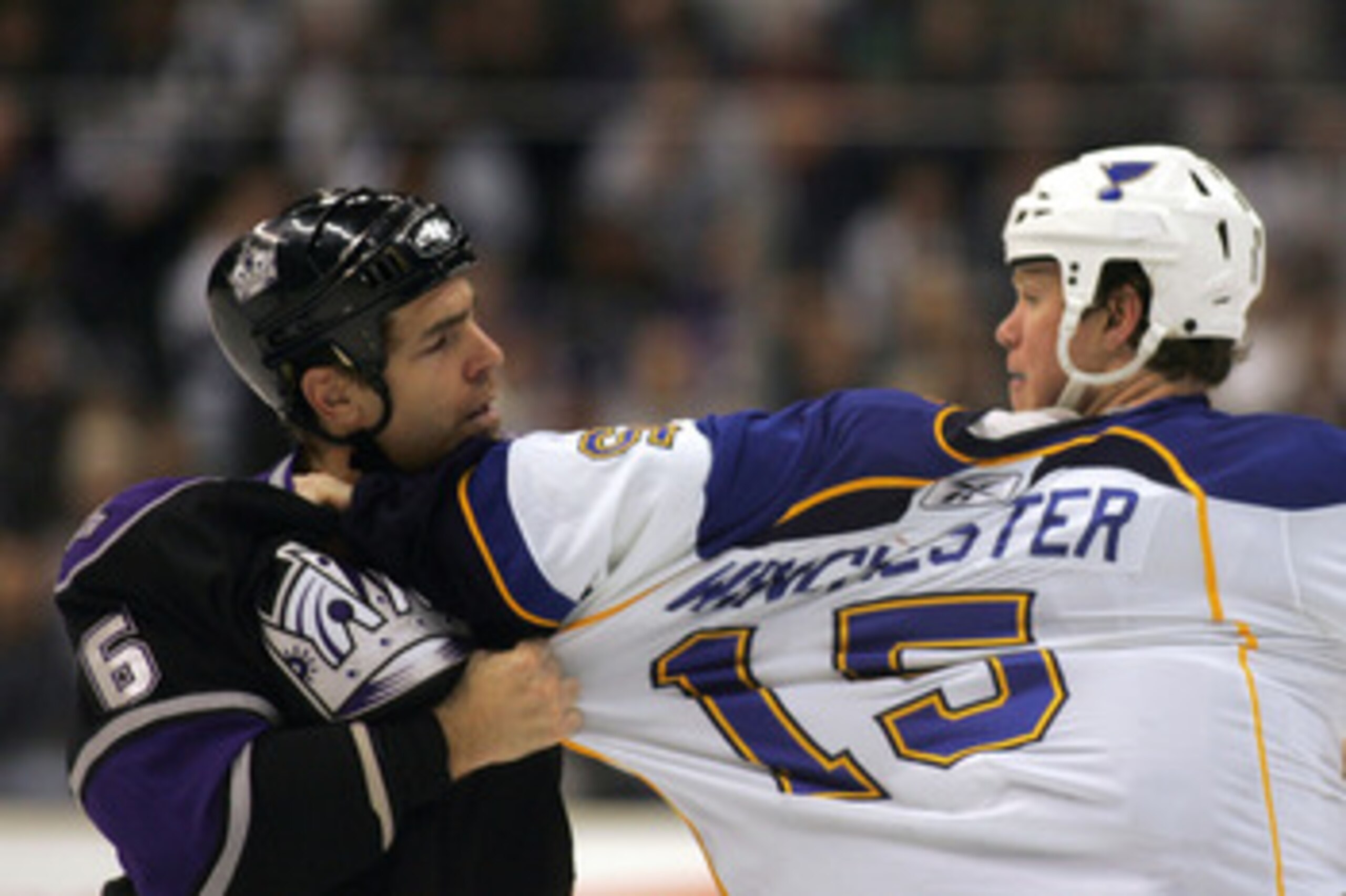 LOS ANGELES, CA - JANUARY 09:  Sean O'Donnell #6 of the Los Angeles Kings and Brad Winchester #15 of the St. Louis Blues grab one another's jersey during their third period fight in their NHL game at the Staples Center on January 9, 2010 in Los Angeles, C
