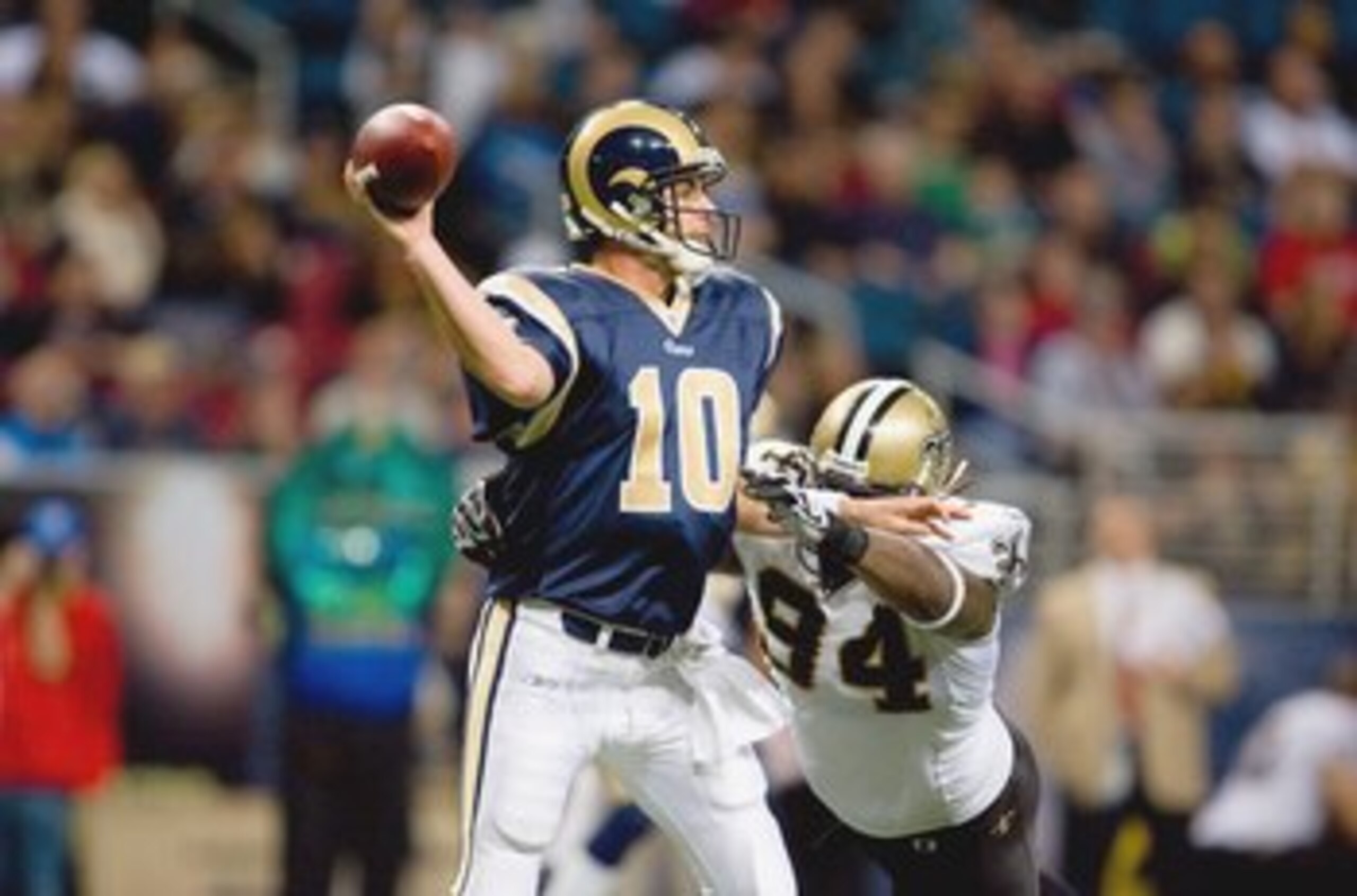 ST. LOUIS - NOVEMBER 15:  Quarterback Marc Bulger #10 of the St. Louis Rams looks to pass the ball against Charles Grant #94 of the New Orleans Saints at the Edward Jones Dome on November 15, 2009 in St. Louis, Missouri.  (Photo by Dilip Vishwanat/Getty I