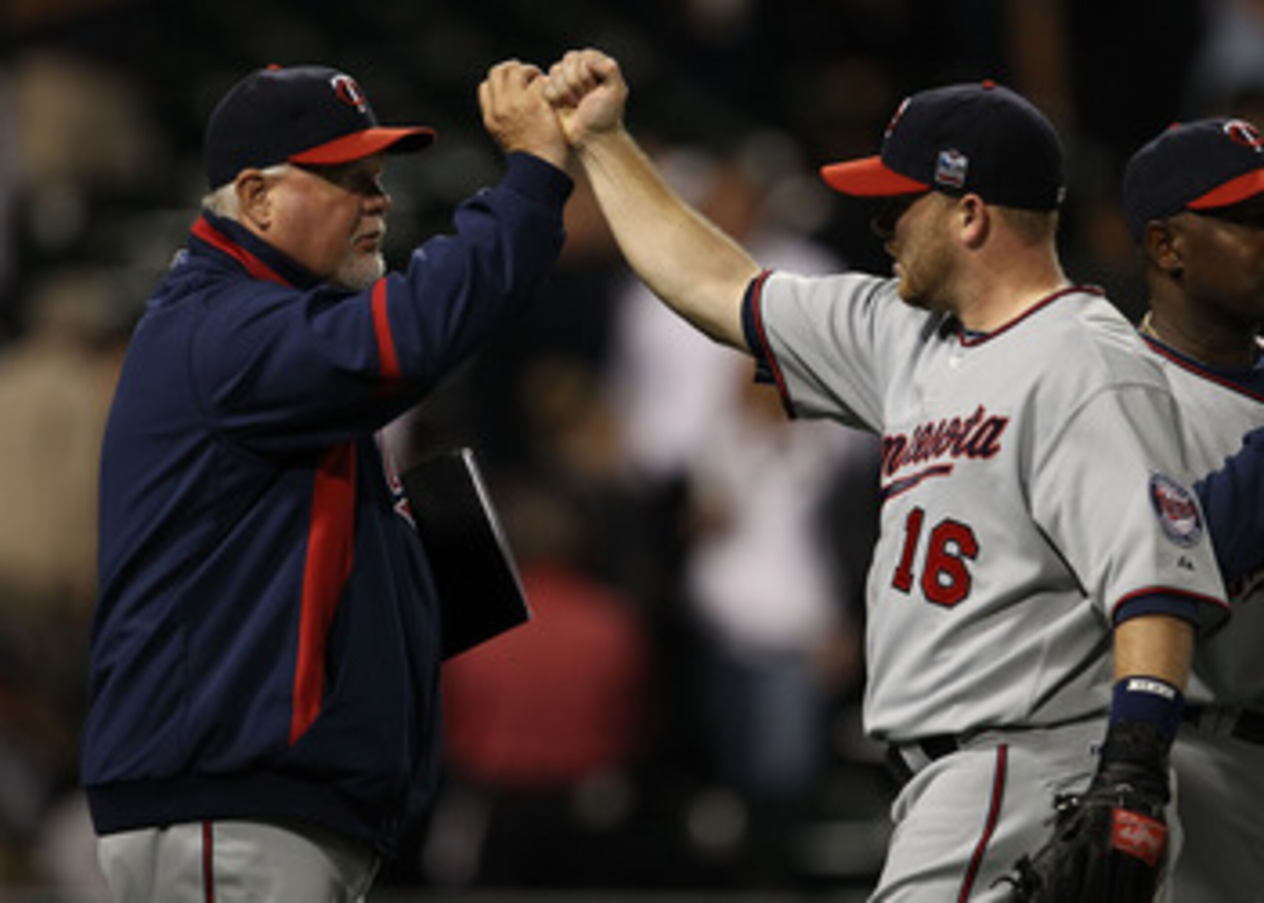 CHICAGO - SEPTEMBER 14: Manager Ron Gardenhire #35 of the Minnesota Twins congratulates Jason Kubel #16 after a win over the Chicago White Sox at U.S. Cellular Field on September 14, 2010 in Chicago, Illinois. The Twins defeated the White Sox 9-3. (Photo CHICAGO - SEPTEMBER 14: Manager Ron Gardenhire #35 of the Minnesota Twins congratulates Jason Kubel #16 after a win over the Chicago White Sox at U.S. Cellular Field on September 14, 2010 in Chicago, Illinois. The Twins defeated the White Sox 9-3. (Photo