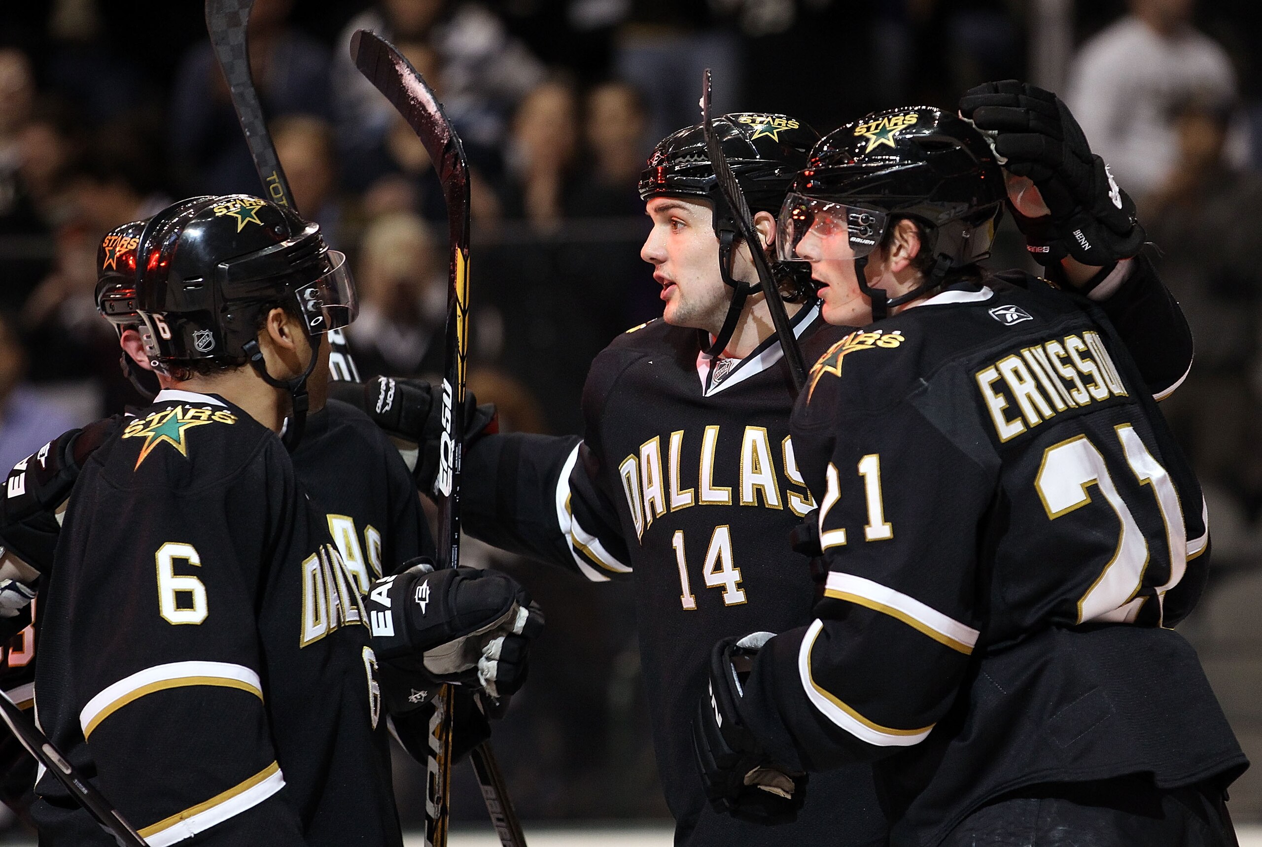 DALLAS, TX - MARCH 09:   Left wing Jamie Benn #14 of the Dallas Stars celebrates a goal with Loui Eriksson #21 against the Calgary Flames at American Airlines Center on March 9, 2011 in Dallas, Texas.  (Photo by Ronald Martinez/Getty Images)