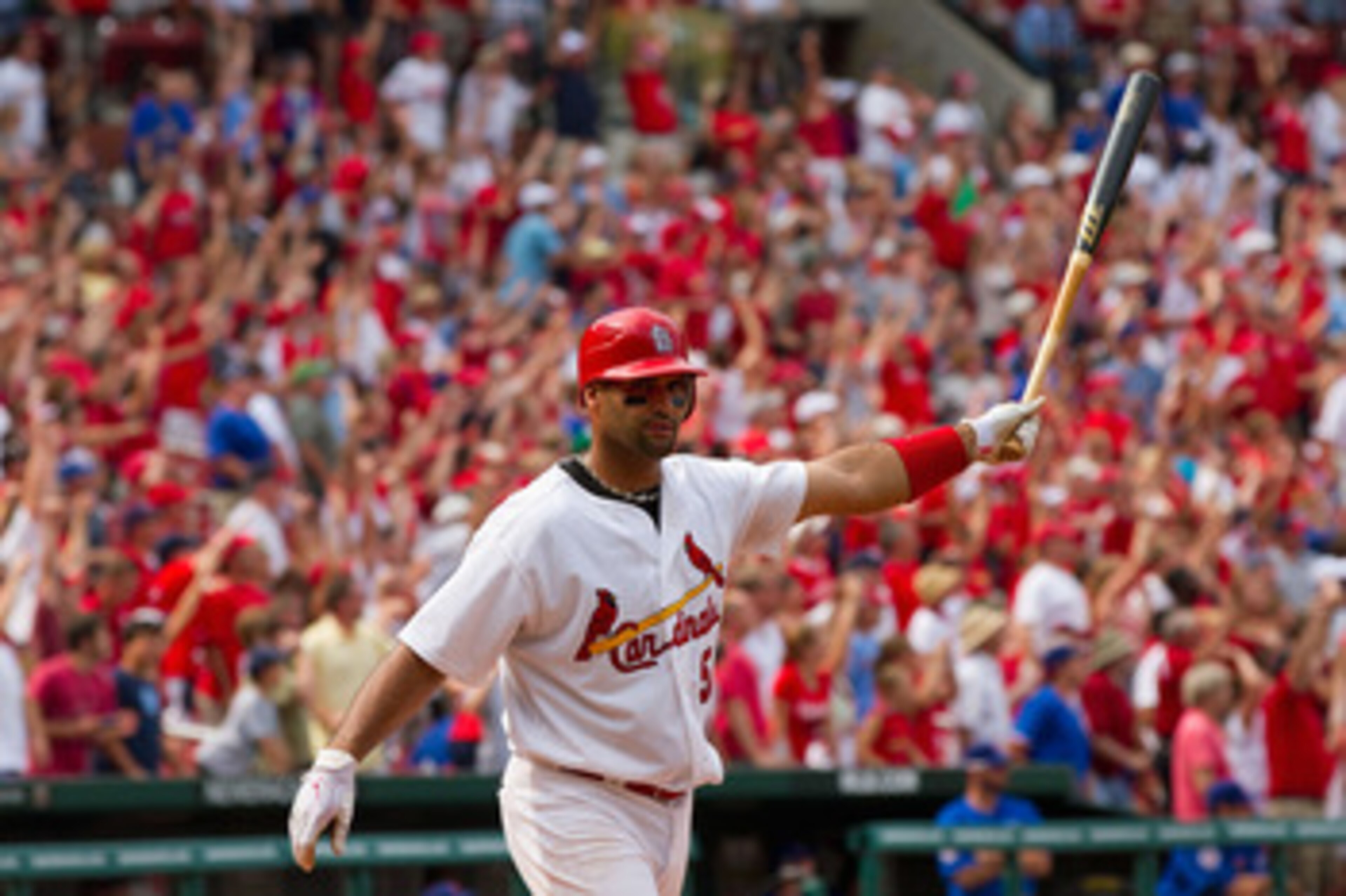 ST. LOUIS, MO - JUNE 5: Albert Pujols #5 of the St. Louis Cardinals celebrates his walk-off home run against the Chicago Cubs at Busch Stadium on June 5, 2011 in St. Louis, Missouri.  The Cardinals beat the Cubs 3-2 in 10 innings.  (Photo by Dilip Vishwan