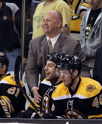 BOSTON - MAY 03:  Head coach Claude Julien of the Boston Bruins congratulates Milan Lucic #17 after he scored the game winner in the third period against the Philadelphia Flyers in Game Two of the Eastern Conference Semifinals during the 2010 NHL Stanley