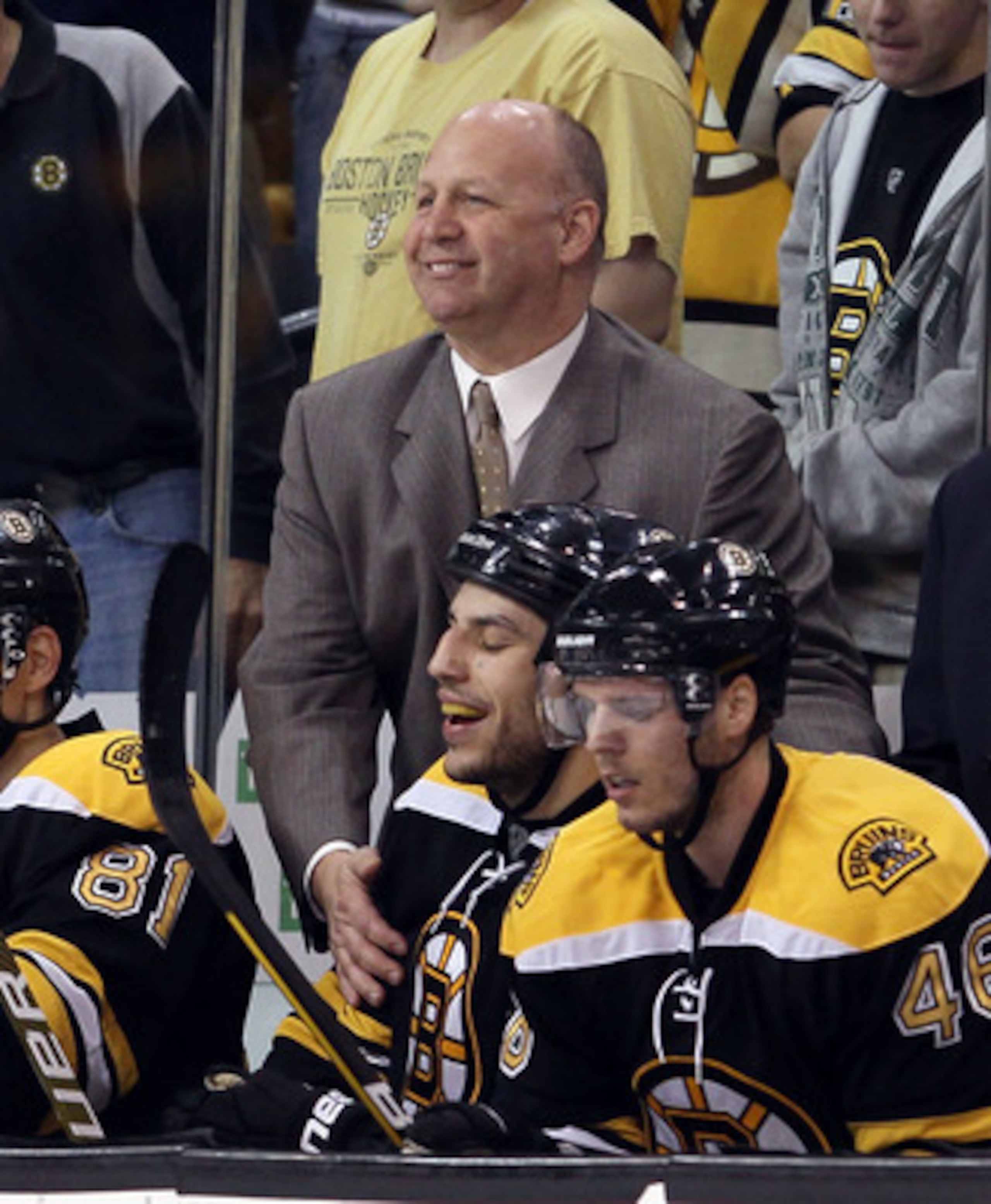 BOSTON - MAY 03:  Head coach Claude Julien of the Boston Bruins congratulates Milan Lucic #17 after he scored the game winner in the third period against the Philadelphia Flyers in Game Two of the Eastern Conference Semifinals during the 2010 NHL Stanley