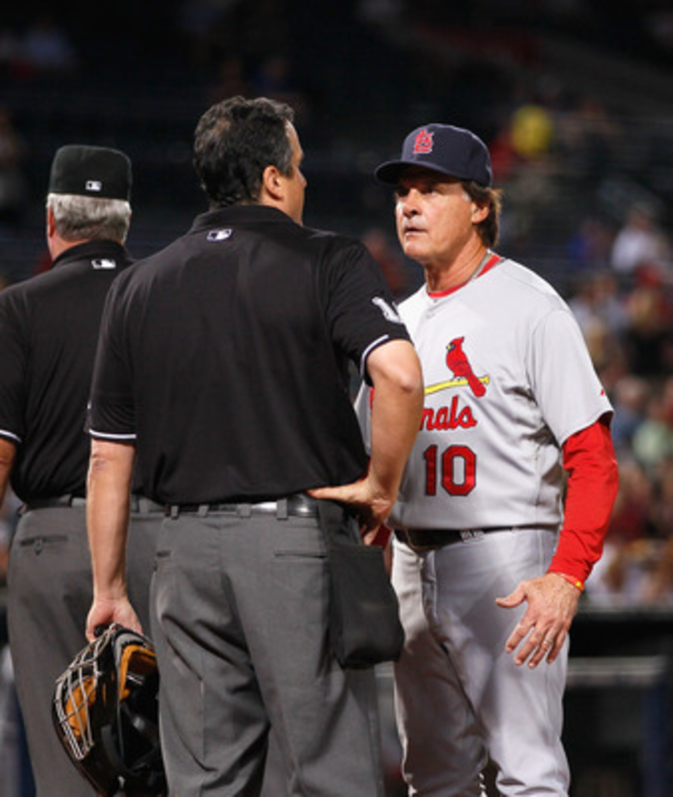 ATLANTA - SEPTEMBER 09:  Homeplate umpire Mike DiMuro #16 and manager Tony LaRussa of the St. Louis Cardinals against the Atlanta Braves at Turner Field on September 9, 2010 in Atlanta, Georgia.  (Photo by Kevin C. Cox/Getty Images)