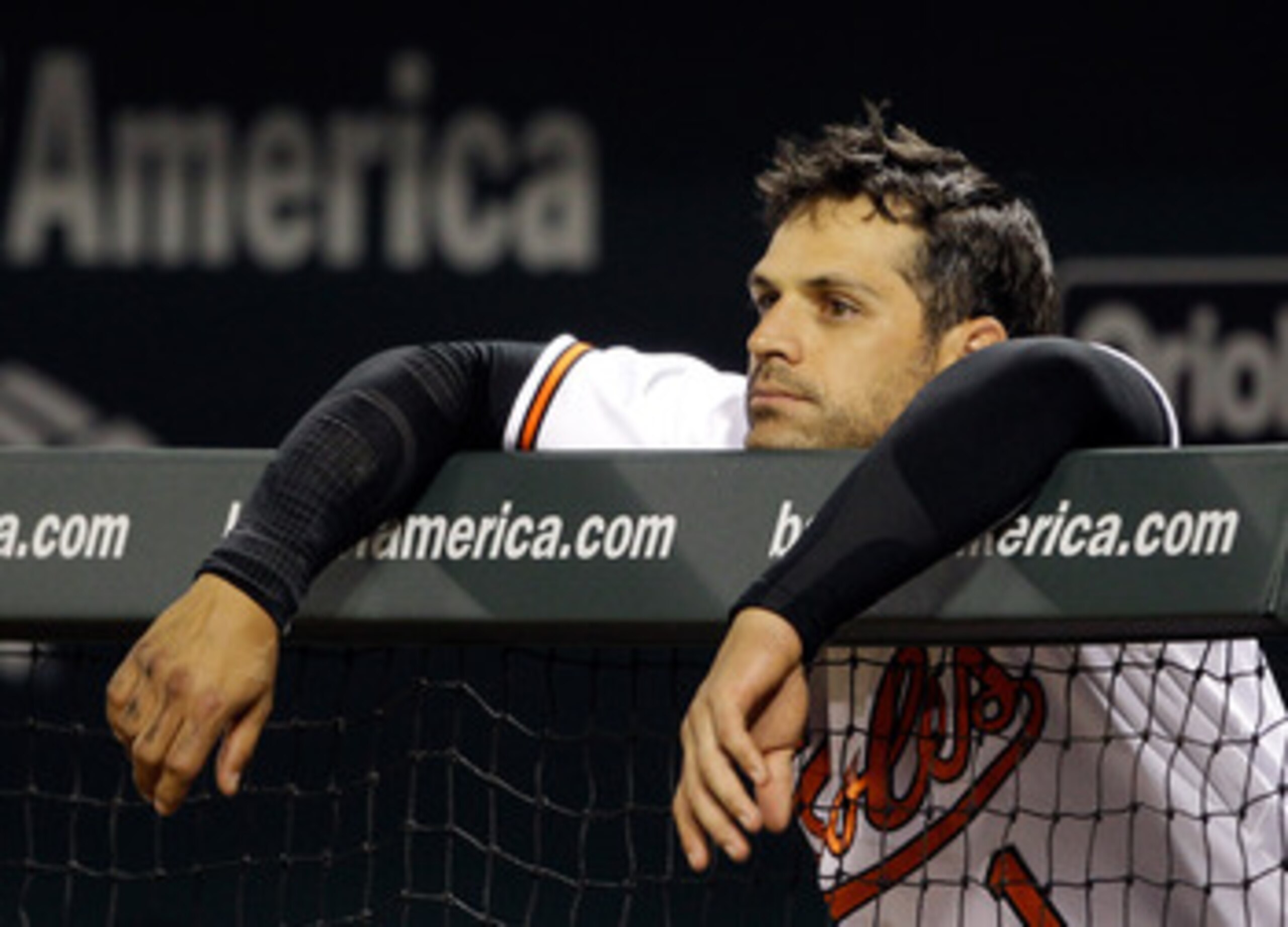 BALTIMORE, MD - APRIL 28: Brian Roberts #1 of the Baltimore Orioles looks on from the dugout during the eighth inning of their 6-2 loss to the Boston Red Sox at Oriole Park at Camden Yards on April 28, 2011 in Baltimore, Maryland.  (Photo by Rob Carr/Gett