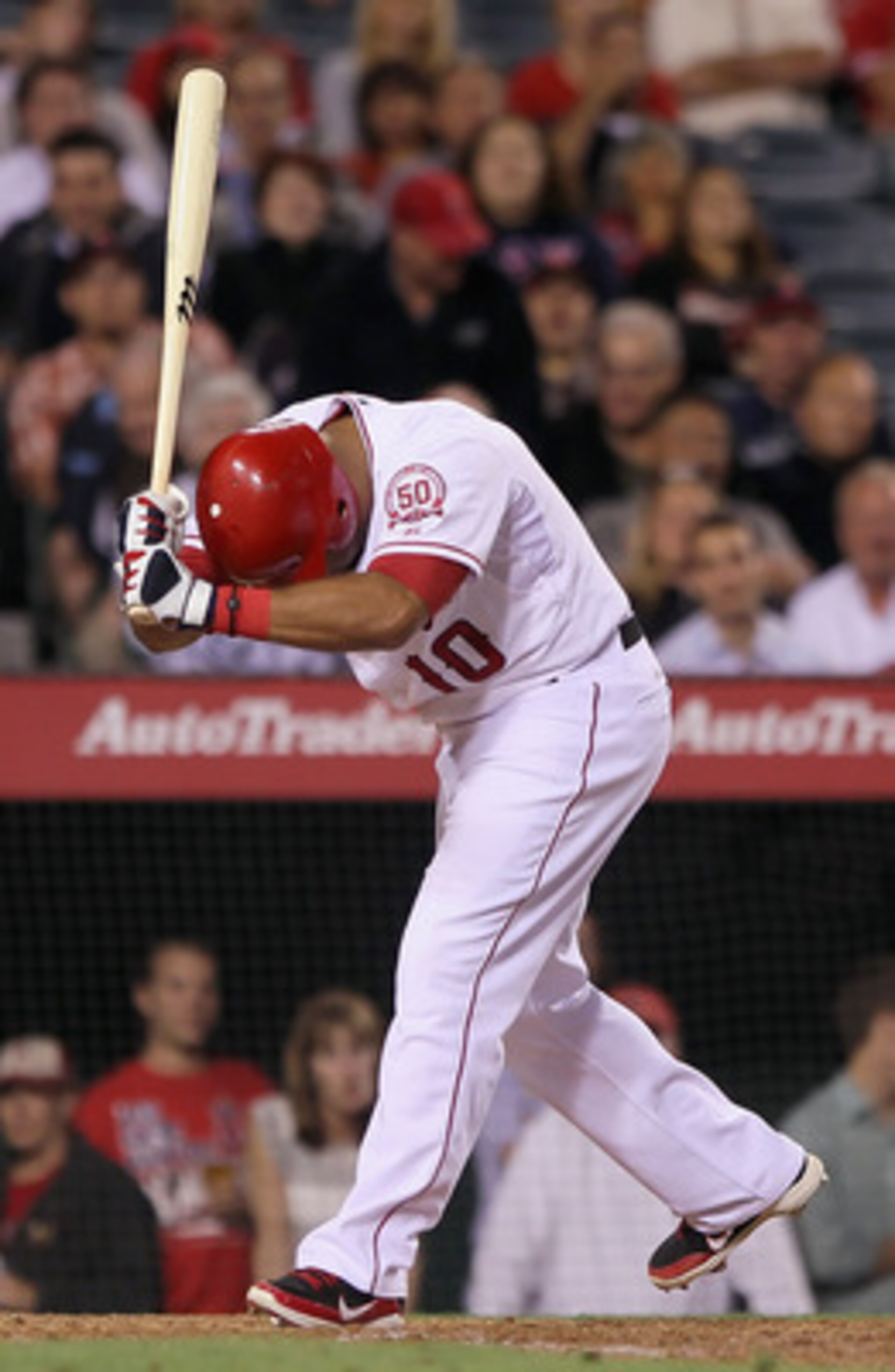 ANAHEIM, CA - JUNE 08:  Vernon Wells #10 of the Los Angeles Angels of Anaheim reacts after striking out in the eighth inning against the Tampa Bay Rays at Angel Stadium of Anaheim on June 8, 2011 in Anaheim, California. The Rays defeated the Angels 4-3 in