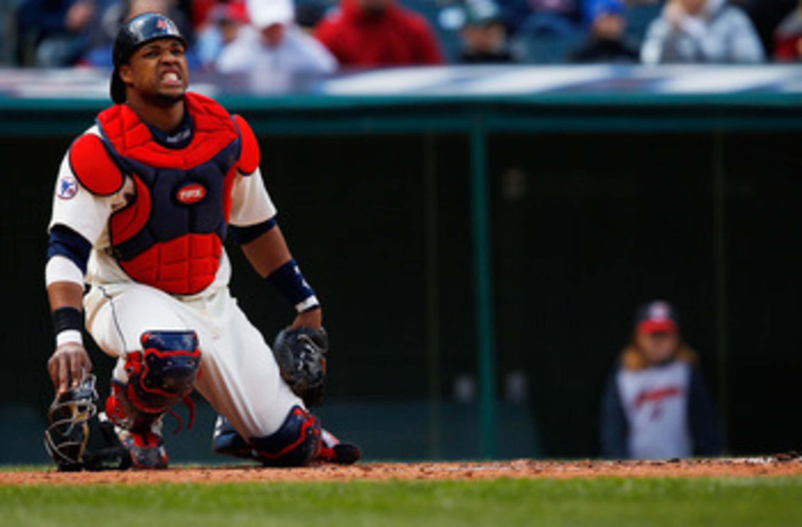CLEVELAND - APRIL 17:  Carlos Santana #41 of the Cleveland Indians grimaces after being hit by a pitch during the game against the Baltimore Orioles on April 17, 2011 at Progressive Field in Cleveland, Ohio.  (Photo by Jared Wickerham/Getty Images)