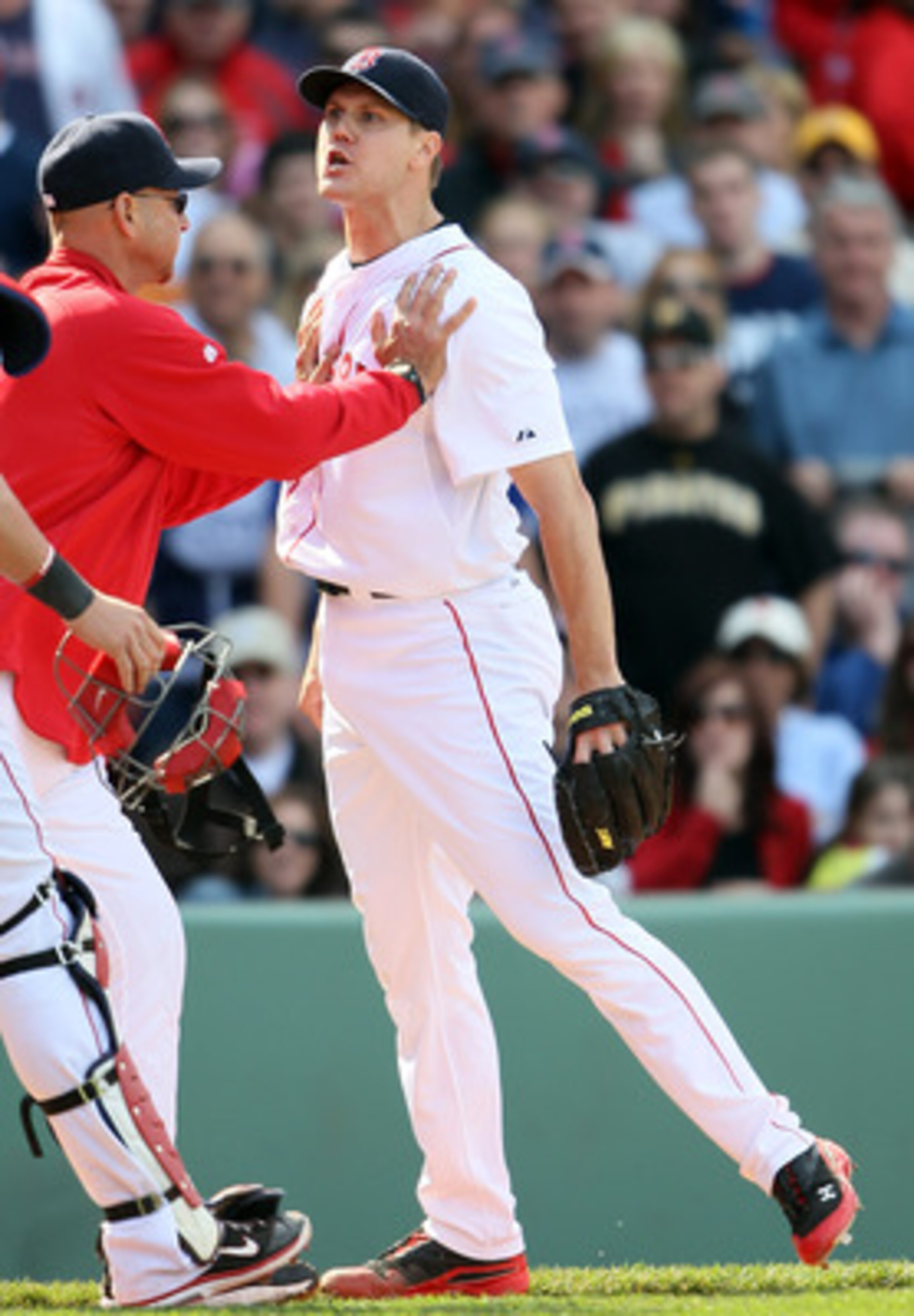 BOSTON, MA - JUNE 04:  Jonathan Papelbon #58 of the Boston Red Sox is held back by manager Terry Francona #47 in the ninth inning against the Oakland Athletics on June 4, 2011 at Fenway Park in Boston, Massachusetts.  (Photo by Elsa/Getty Images)