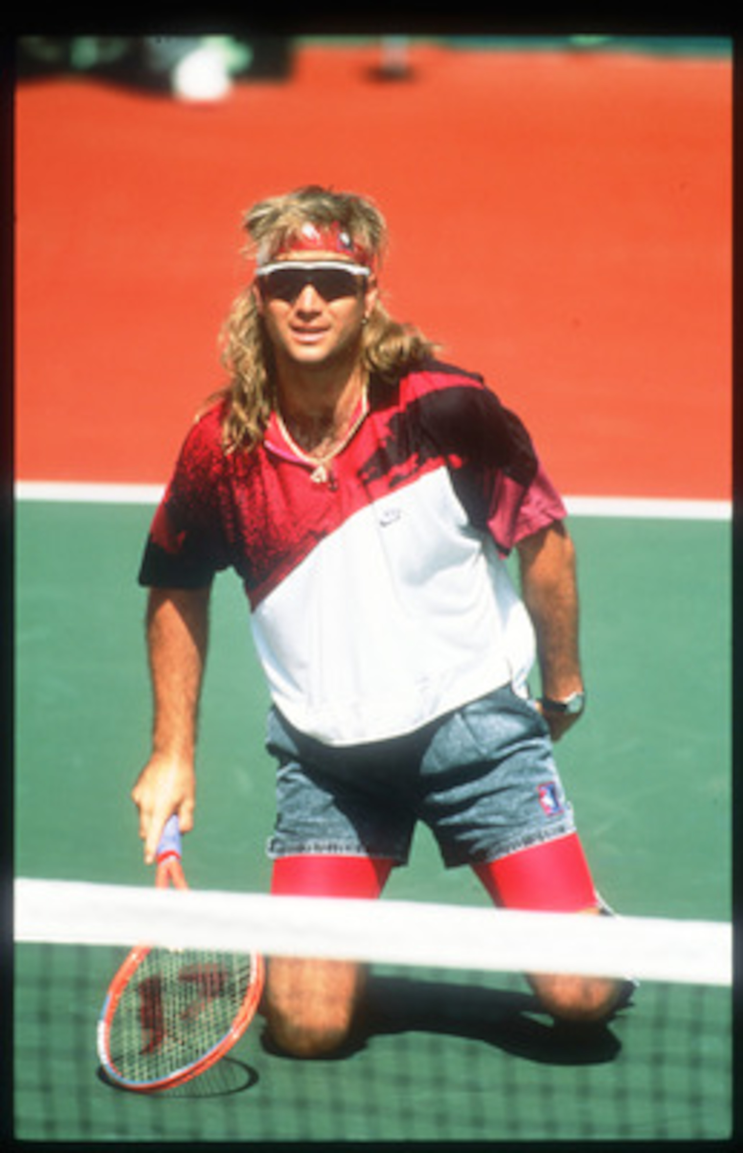 124853 06: Tennis Player Andre Agassi Kneels On A Tennis Court November 15, 1991 In USA. Agassi Made His Presence Known In 1987 In The Semifinals In Stratton Mountain And Went On To Win Several Titles Including His First Grand Slam Final At The French Ope