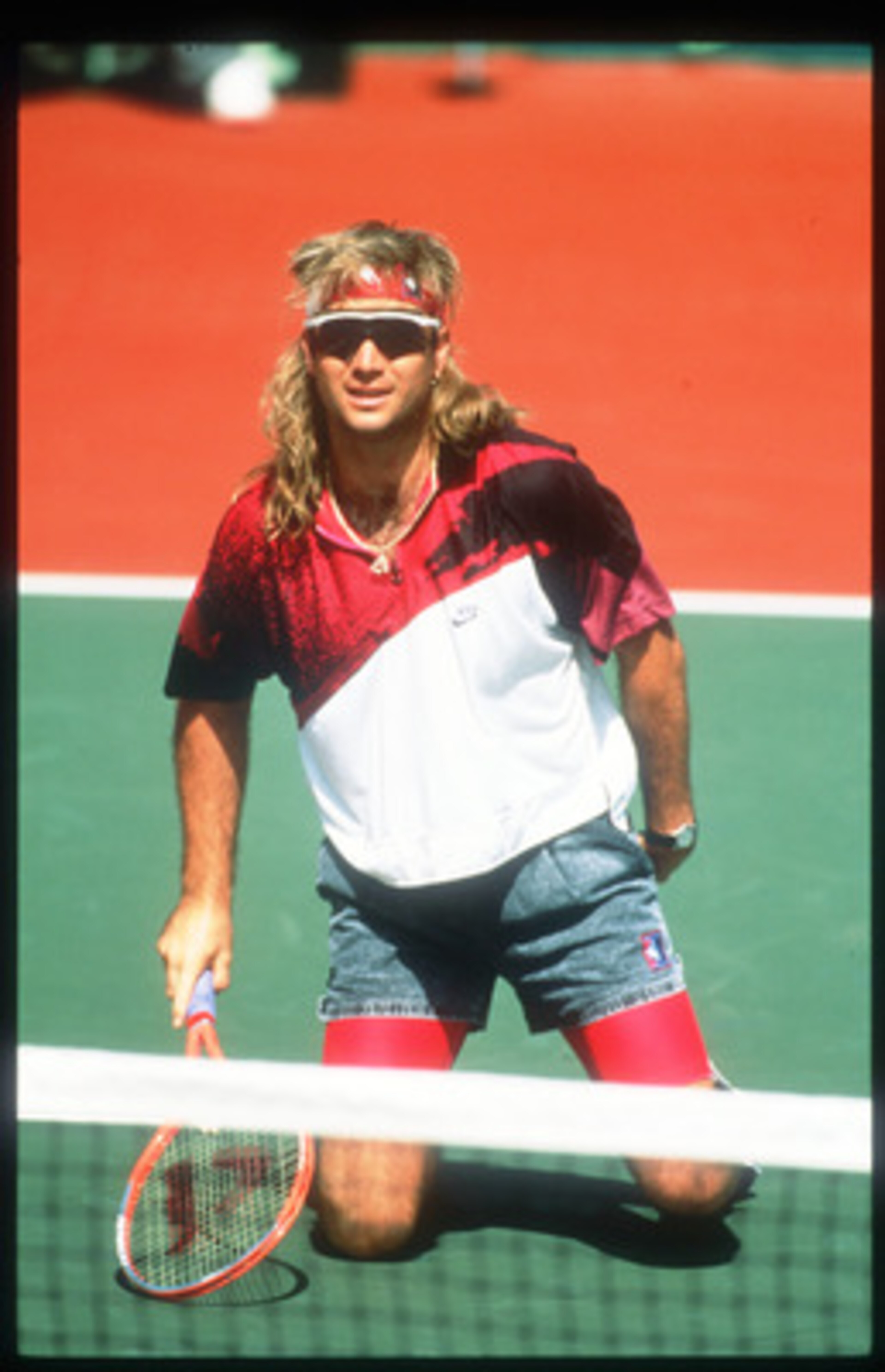 124853 06: Tennis Player Andre Agassi Kneels On A Tennis Court November 15, 1991 In USA. Agassi Made His Presence Known In 1987 In The Semifinals In Stratton Mountain And Went On To Win Several Titles Including His First Grand Slam Final At The French Ope
