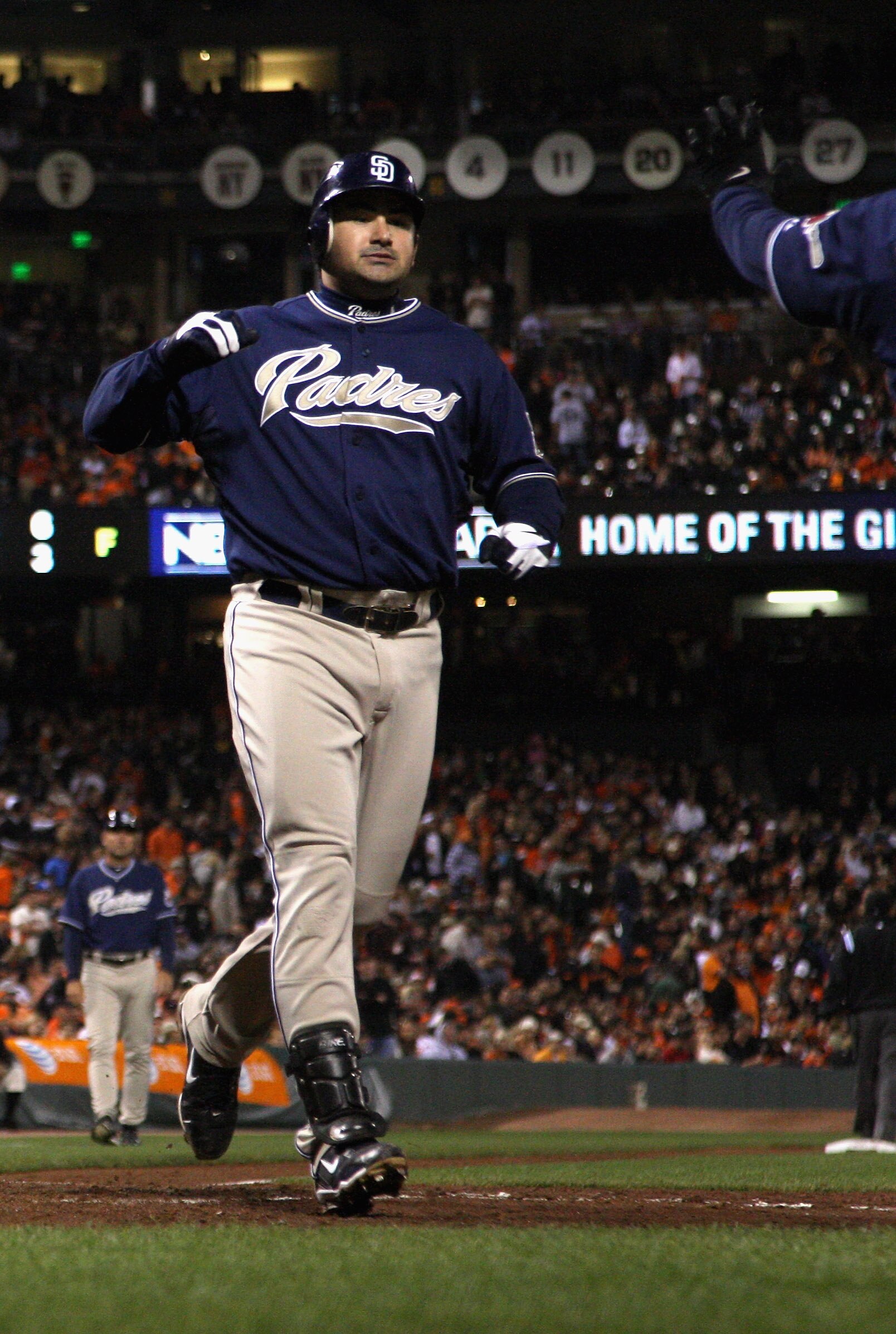 SAN FRANCISCO - OCTOBER 01:  Adrain Gonzalez #23 of the San Diego Padres crosses home plate after he hit a three-run home run to give the Padres a 4-0 lead over the San Francisco Giants in the third inning at AT&T Park on October 1, 2010 in San Francisco,