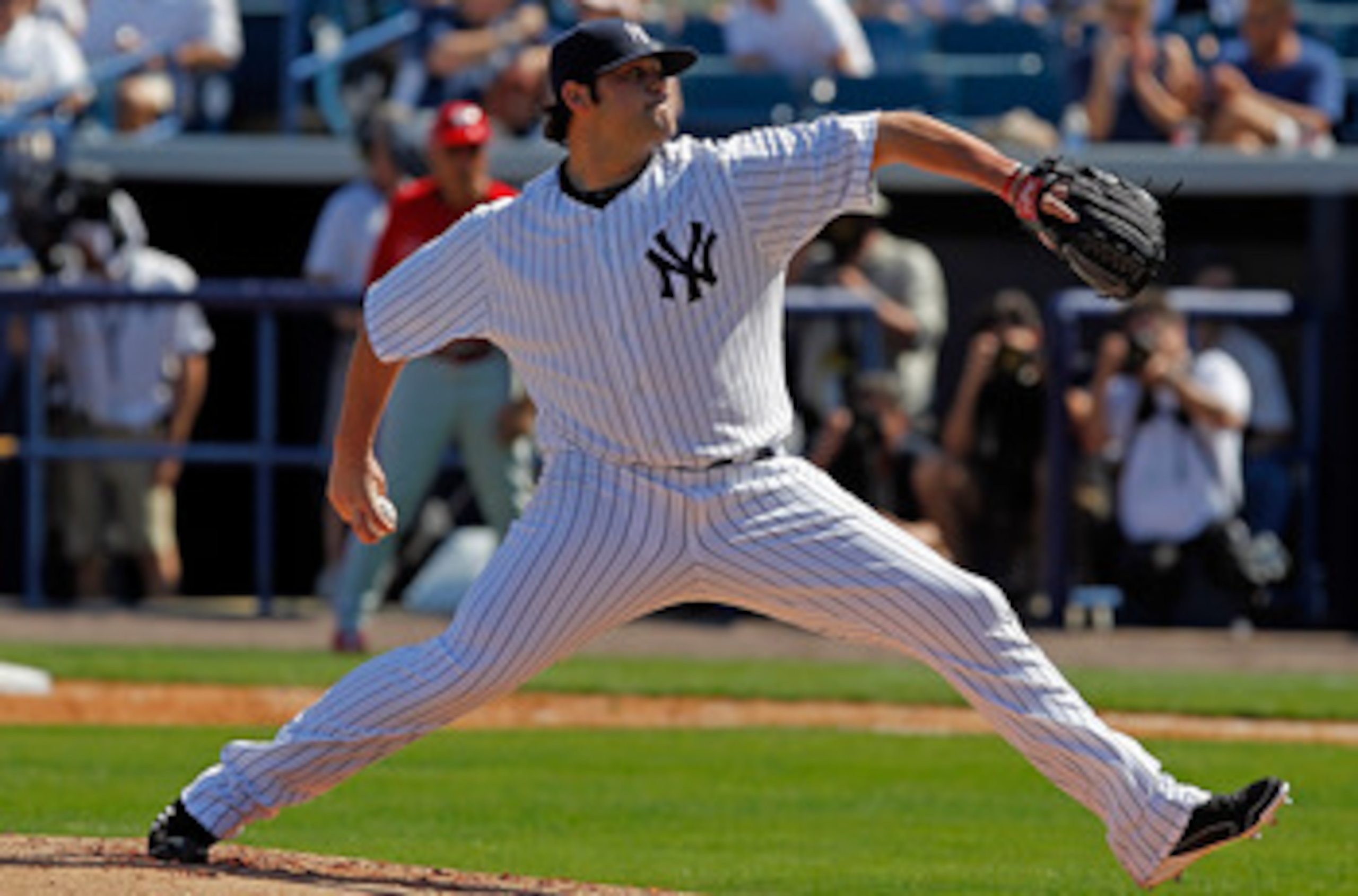 TAMPA, FL - FEBRUARY 26:  Pitcher Joba Chamberlain #62 of the New York Yankees pitches against the Philadelphia Phillies during a Grapefruit League Spring Training Game at George M. Steinbrenner Field on February 26, 2011 in Tampa, Florida.  (Photo by J.