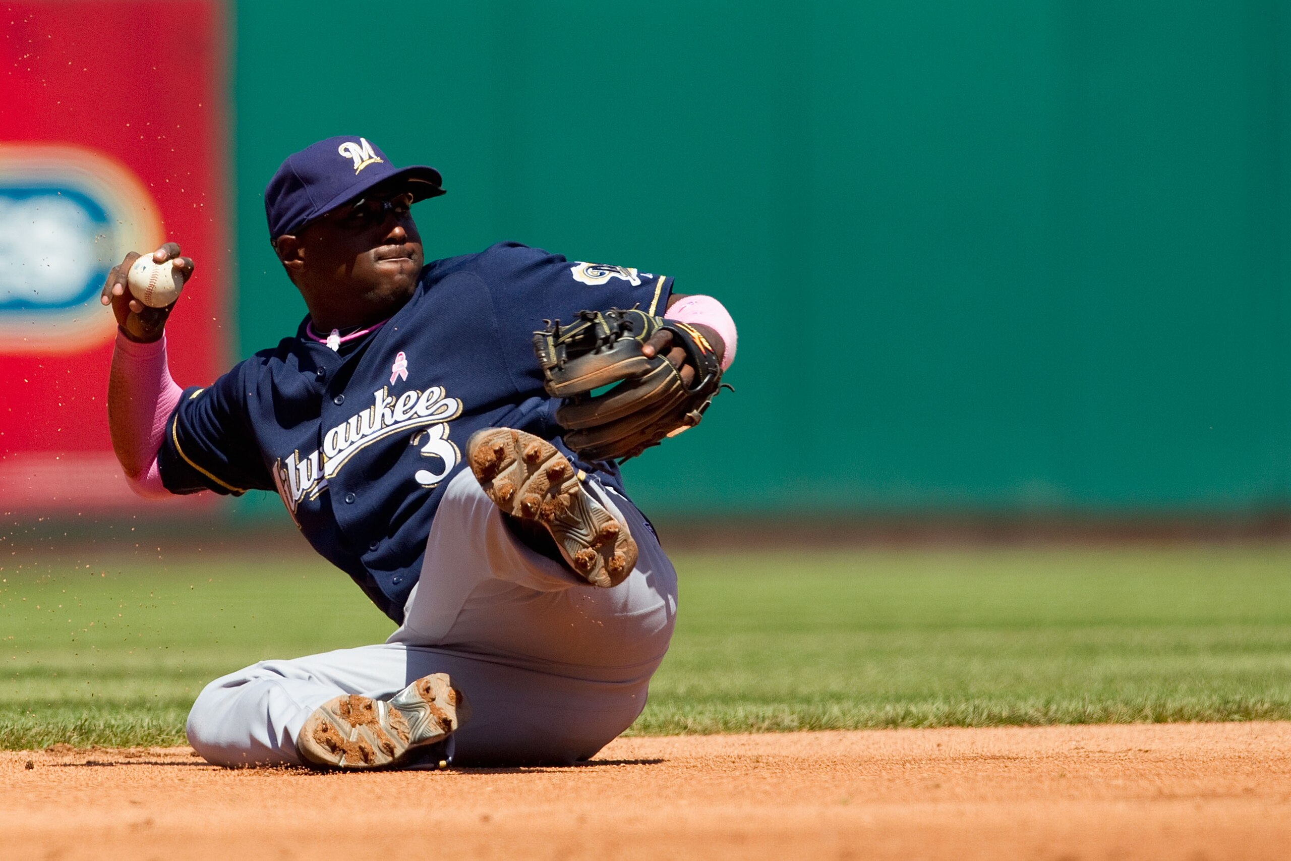 ST. LOUIS, MO - MAY 8: Yuniesky Betancourt #3 of the Milwaukee Brewers attempts to throw to second base against the St. Louis Cardinals at Busch Stadium on May 8, 2011 in St. Louis, Missouri.  (Photo by Dilip Vishwanat/Getty Images)