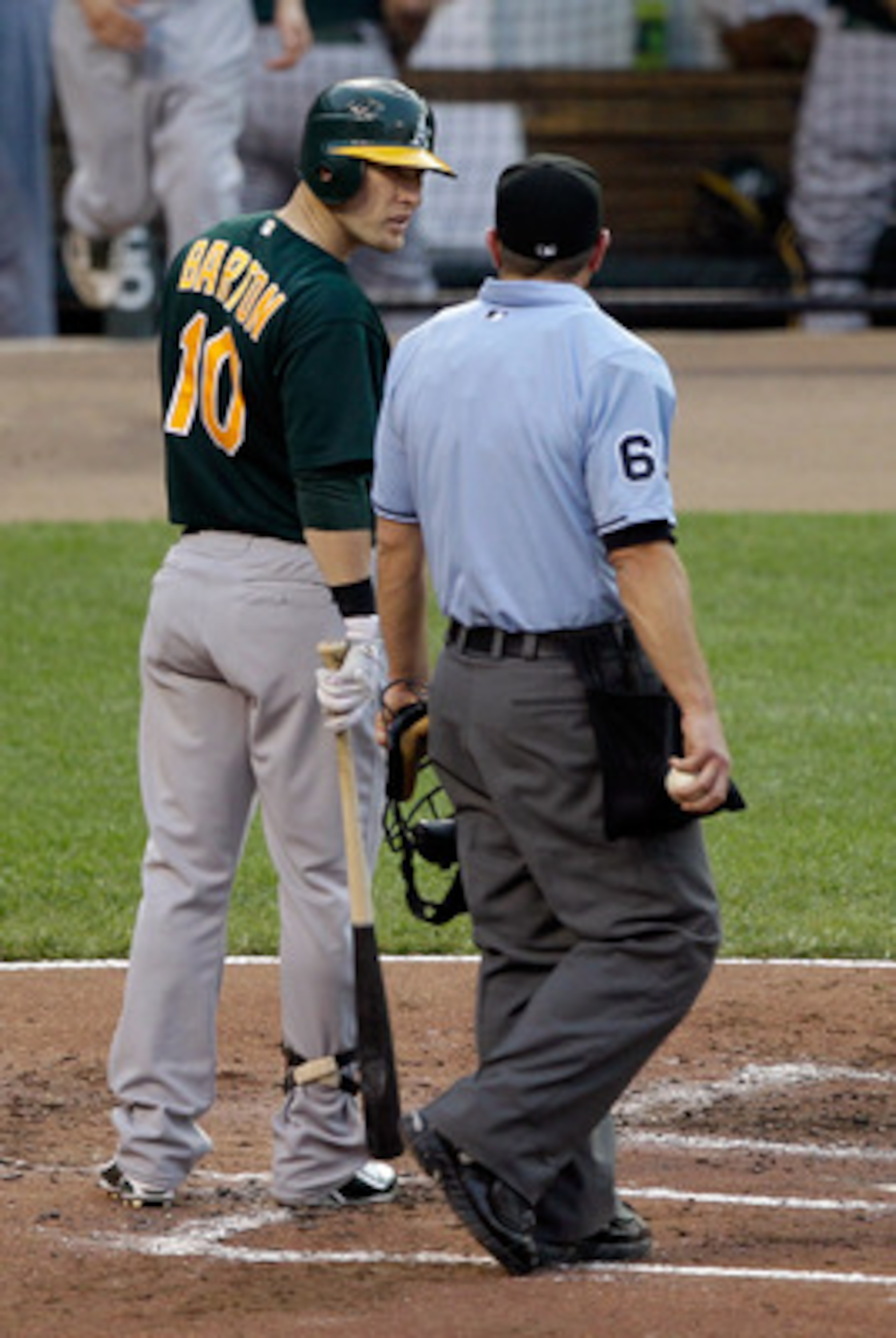 BALTIMORE, MD - JUNE 08: Daric Barton #10 of the Oakland Athletics has words with umpire Chris Guccione after striking out to end the third inning against the Baltimore Orioles at Oriole Park at Camden Yards on June 8, 2011 in Baltimore, Maryland. The Bal