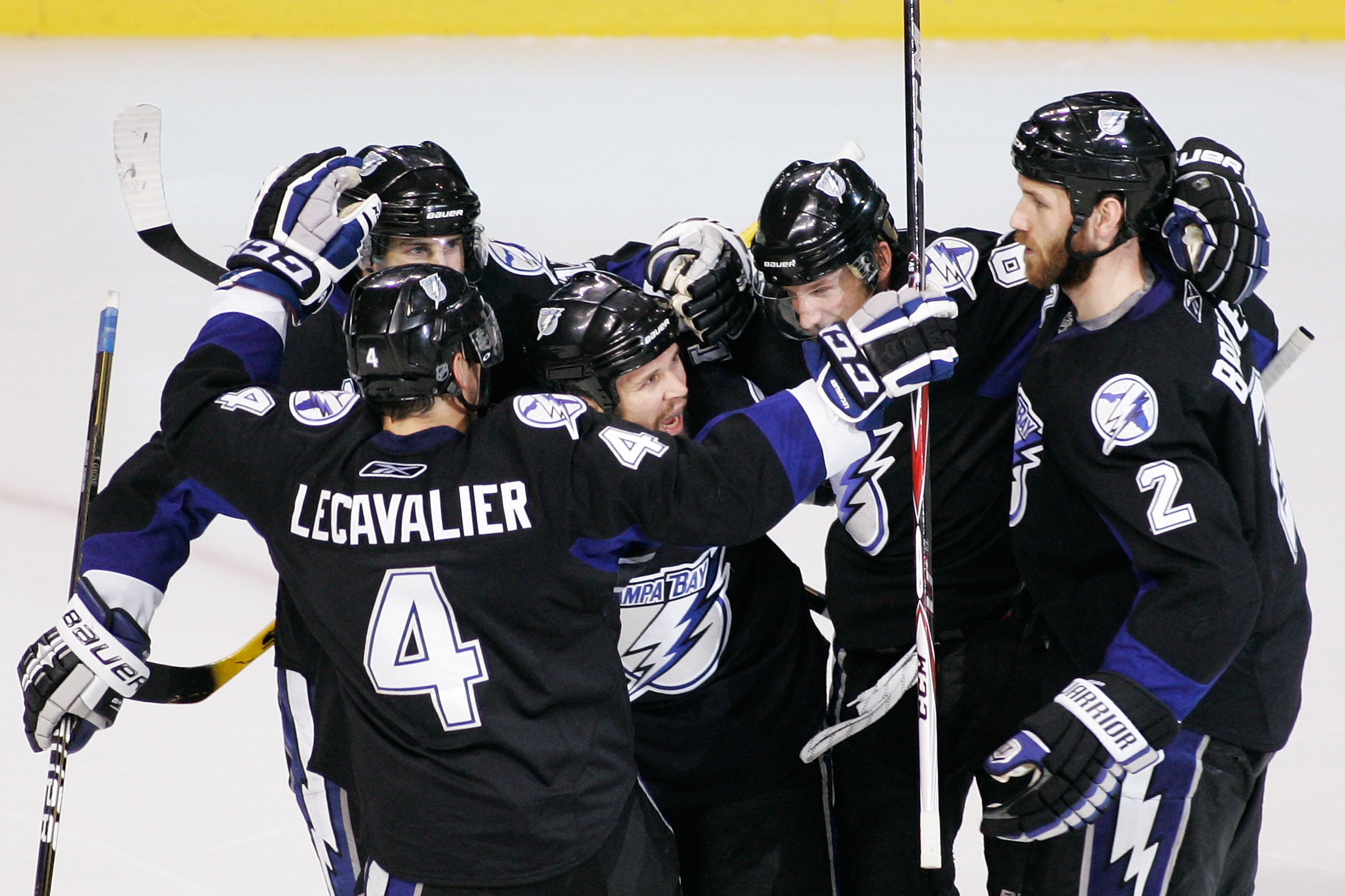 TAMPA, FL - MAY 25:  Martin St. Louis #26 of the Tampa Bay Lightning celebrates his second period goal with teammates in Game Six of the Eastern Conference Finals against the Boston Bruins during the 2011 NHL Stanley Cup Playoffs at St Pete Times Forum on