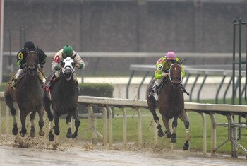 Jockey Garrett Gomez (2) and Saalb on the rail  at the  finish of  the muddy seventh race at Churchill Downs May 3, 2007  in Louisville. (Photo by A. Messerschmidt/Getty Images)