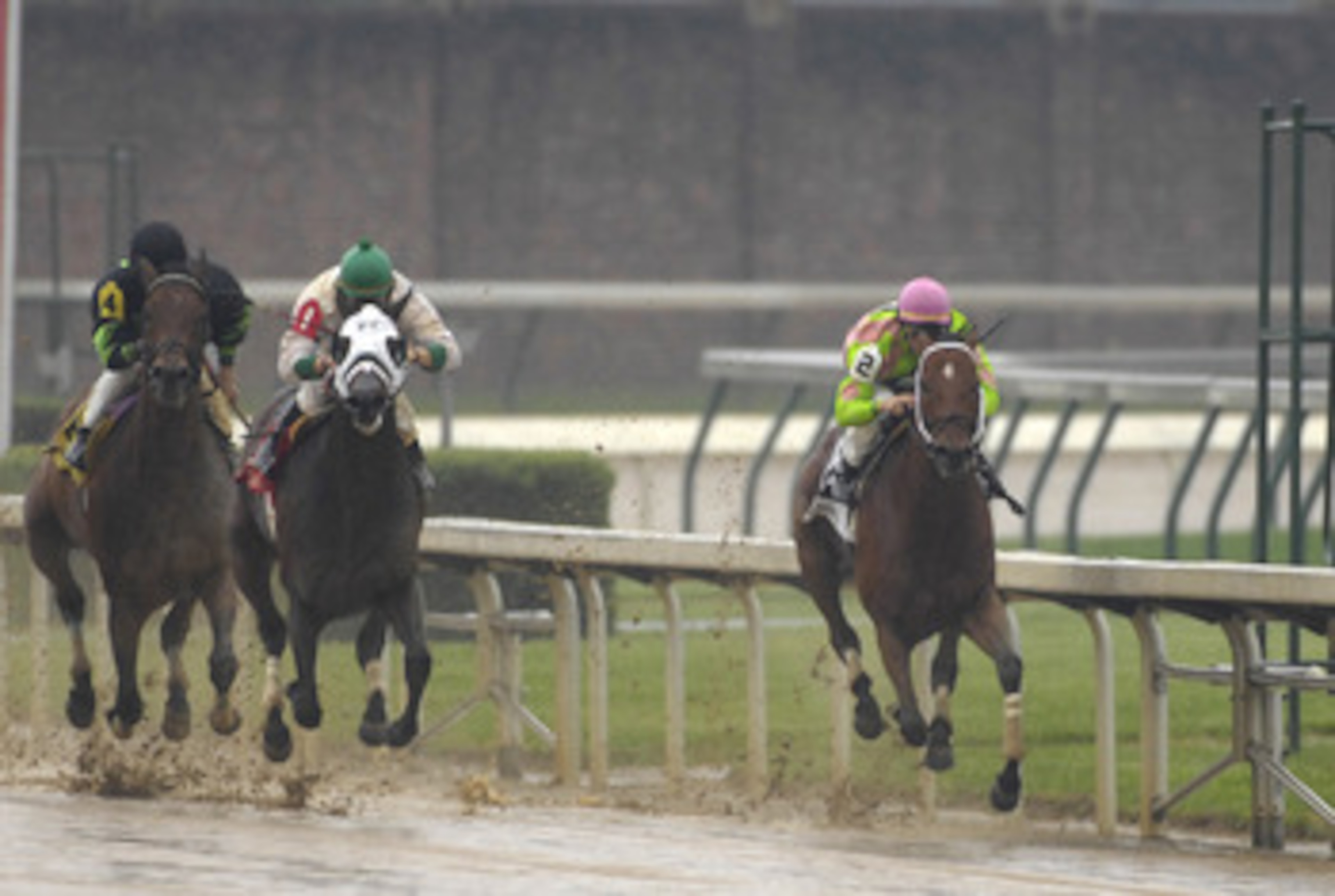 Jockey Garrett Gomez (2) and Saalb on the rail  at the  finish of  the muddy seventh race at Churchill Downs May 3, 2007  in Louisville. (Photo by A. Messerschmidt/Getty Images)
