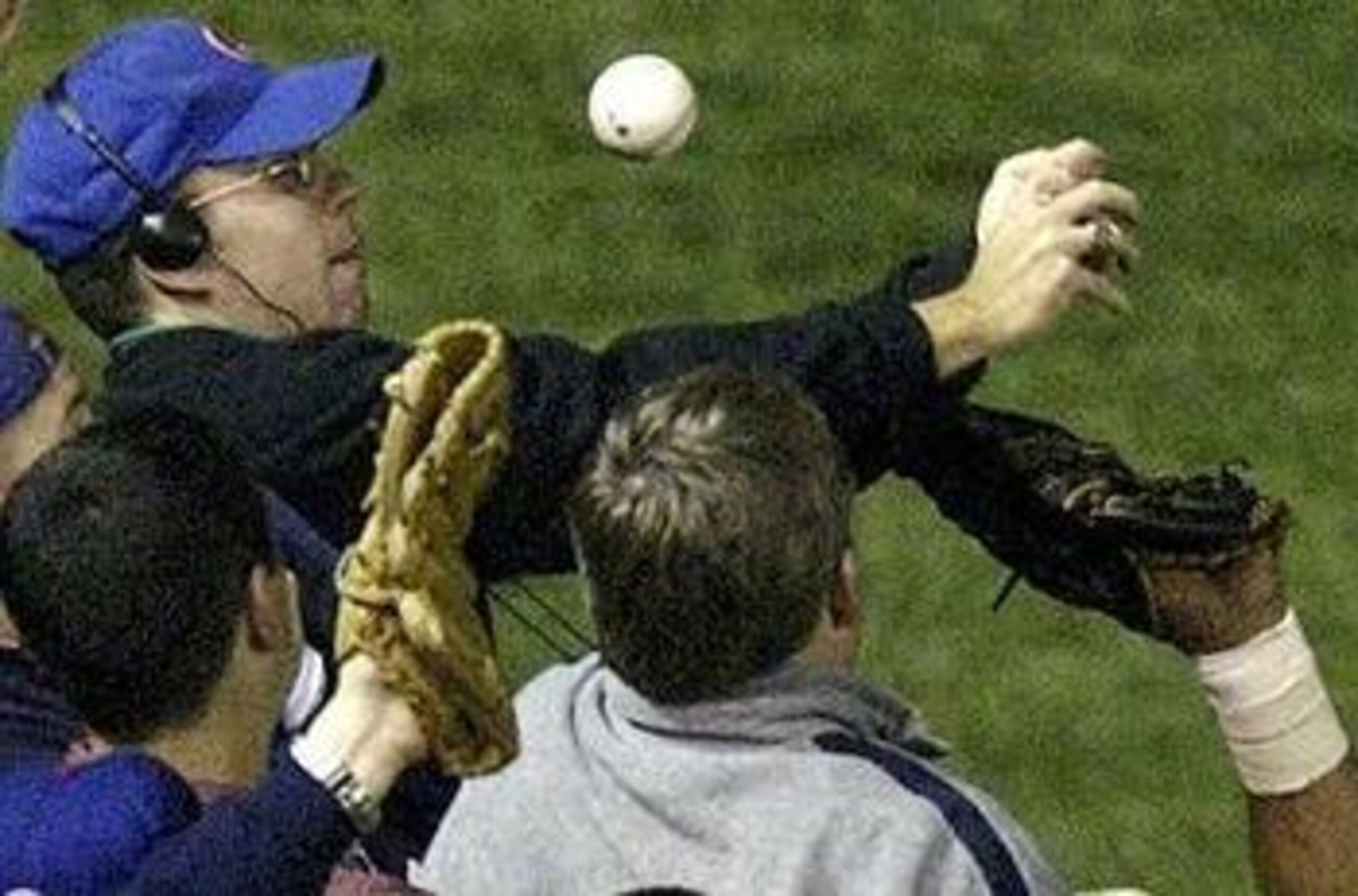 CHICAGO - FEBURARY 26:  Musicians Billy Corgan (l) and Rick Nielson pose with the cursed Chicago Cubs baseball before it was destroyed on February 26, 2004 at Harry Caray's Restaurant in Chicago, Illinois. The alleged curse comes from a play during the NL
