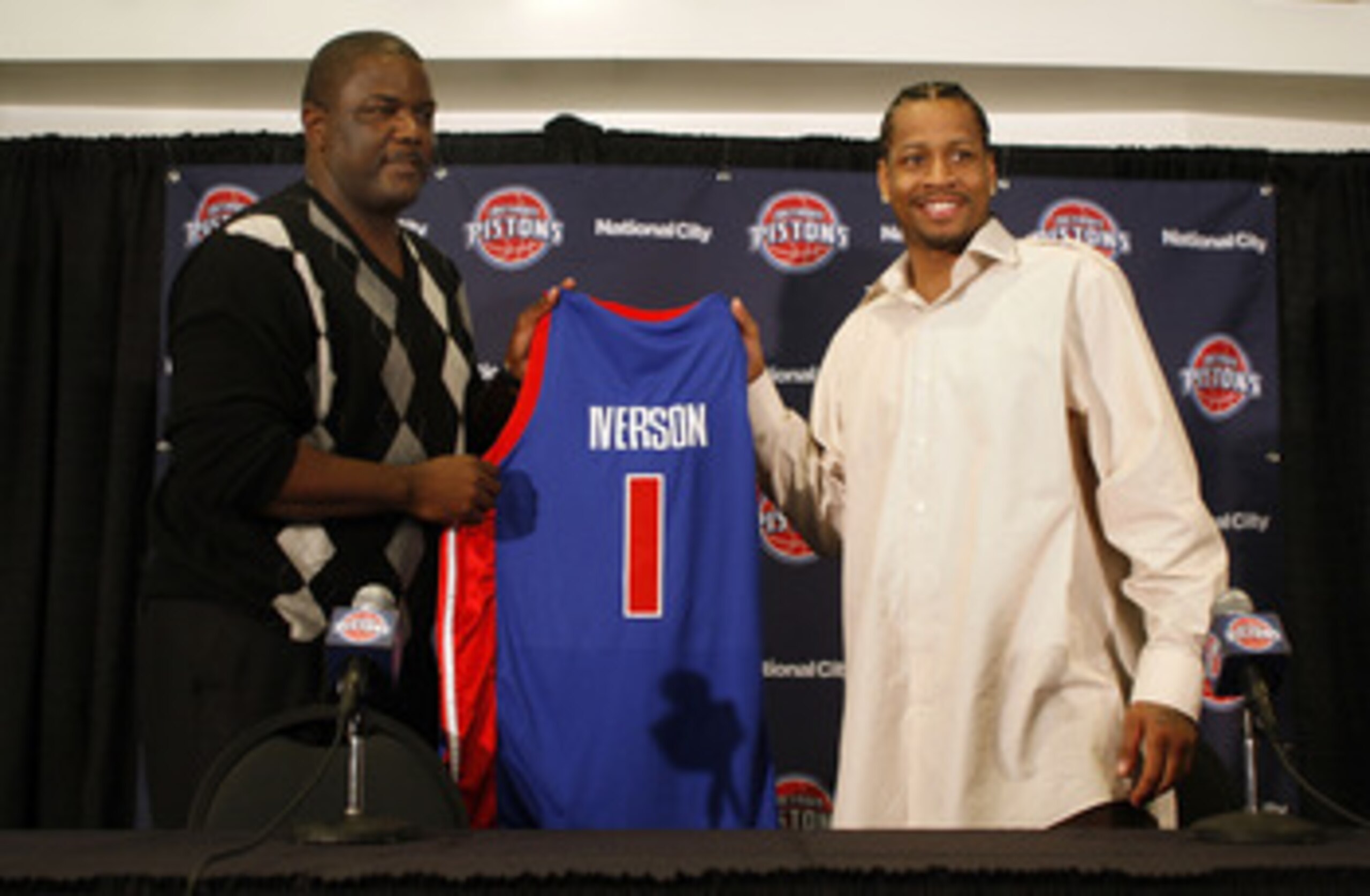 AUBURN HILLS, MI - NOVEMBER 04:  Allen Iverson #1 of the Detroit Pistons is introduced at press conference by President of Basketball Operations Joe Dumars after being traded from the Denver Nuggets on November 4, 2008 at the Palace of Auburn Hills in Aub