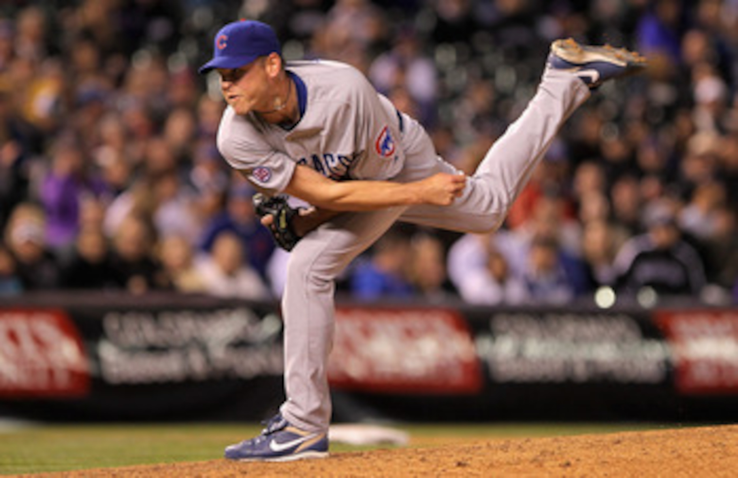 DENVER, CO - APRIL 16:  Relief pitcher Kerry Wood #34 of the Chicago Cubs works against Jason Giambi #23 of the Colorado Rockies in the eighth inning at Coors Field on April 16, 2011 in Denver, Colorado.  (Photo by Doug Pensinger/Getty Images)