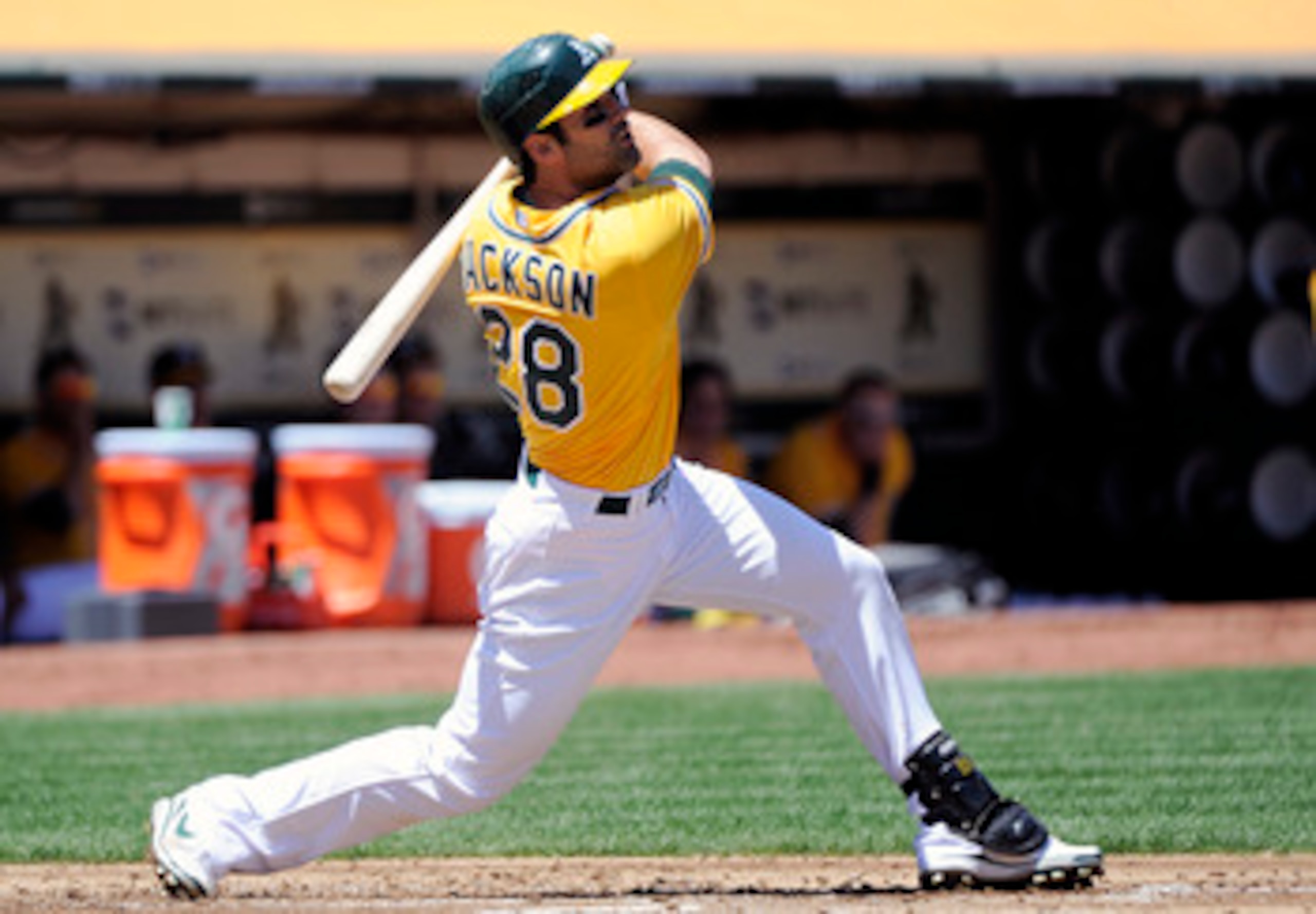 OAKLAND, CA - MAY 1: Conor Jackson #28 of the Oakland Athletics hits a double to drive in two runs in the bottom of the first inning against the Texas Rangers during a MLB baseball game at the Oakland-Alameda County Coliseum May 1, 2011 in Oakland, Califo