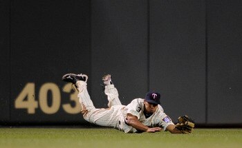 MINNEAPOLIS, MN - JUNE 9: Ben Revere #11 of the Minnesota Twins dives for a ball hit into play by the Texas Rangers during the eighth inning of their game on June 9, 2011 at Target Field in Minneapolis, Minnesota. Twins defeated the Rangers 5-4. (Photo by