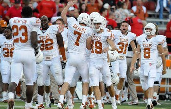 LINCOLN, NE - OCTOBER 16: Quarterback Garrett Gilbert #7 of the Texas Longhorns runs toward his teammates ofter the final of their game against the Nebraska Cornhuskers at Memorial Stadium on October 16, 2010 in Lincoln, Nebraska. Texas Defeated Nebraska