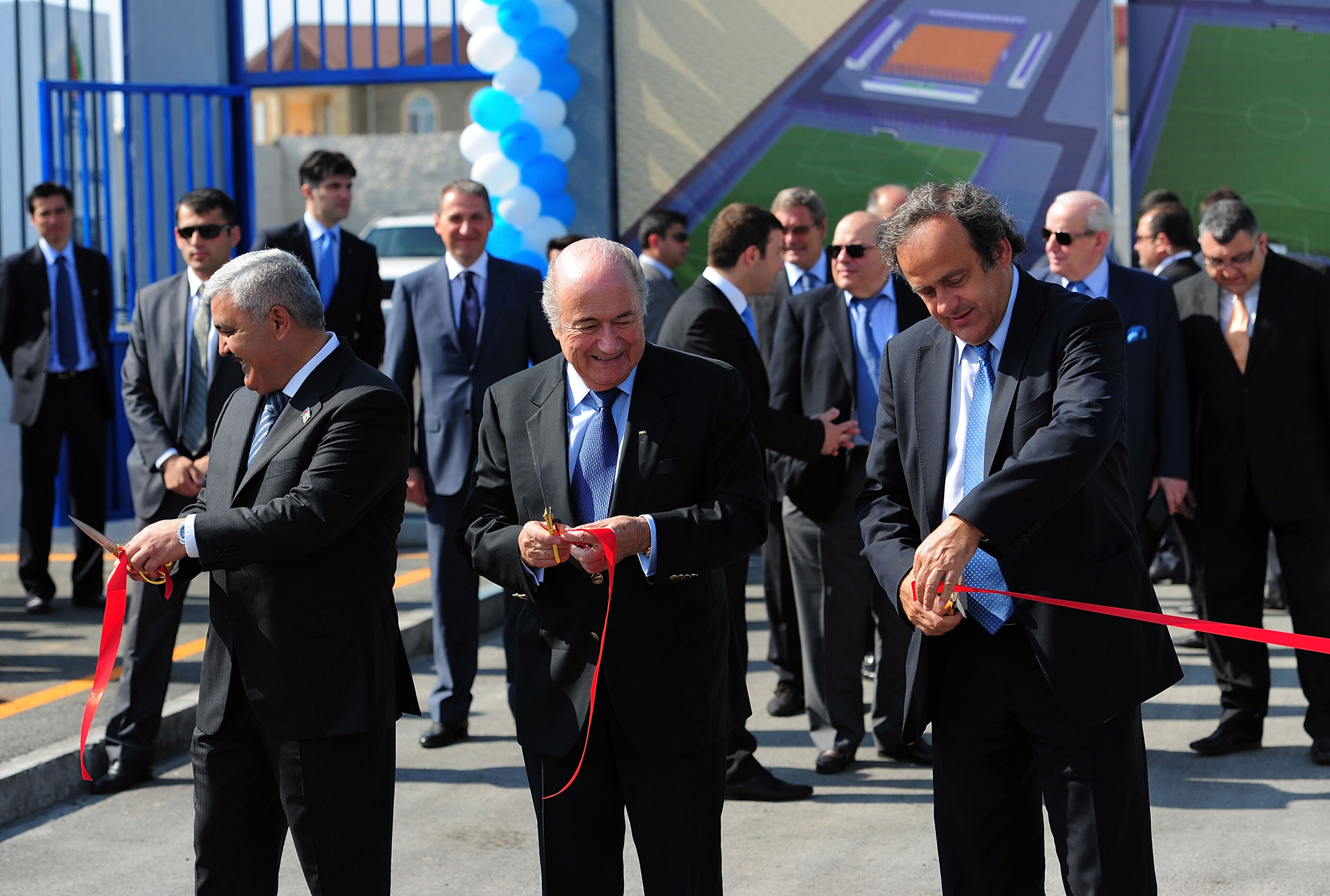 BAKU, AZERBAIJAN - JUNE 06: FIFA president Sepp Blatter (c) and UEFA president Michel Platini (r) take part in the Opening Ceremony of Dalga stadium which will be a venue for the FIFA U17 WWC 2012 during a visit to mark 100 years of Football Azerbaijan BAKU, AZERBAIJAN - JUNE 06: FIFA president Sepp Blatter (c) and UEFA president Michel Platini (r) take part in the Opening Ceremony of Dalga stadium which will be a venue for the FIFA U17 WWC 2012 during a visit to mark 100 years of Football Azerbaijan