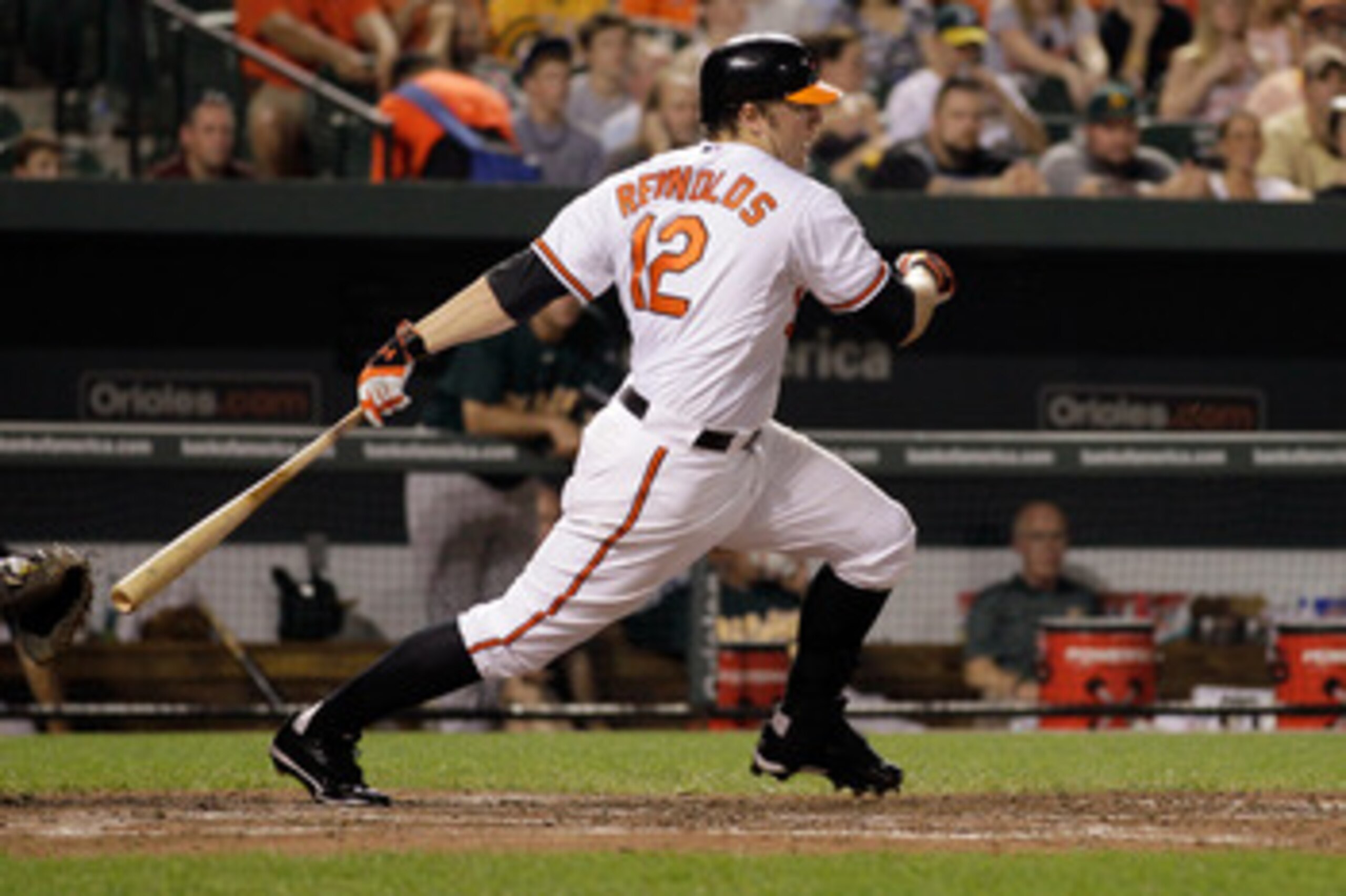 BALTIMORE, MD - JUNE 08: Mark Reynolds #12 of the Baltimore Orioles follows his infield hit against the Oakland Athletics during the eighth inning at Oriole Park at Camden Yards on June 8, 2011 in Baltimore, Maryland. The Baltimore Orioles defeated the Oa