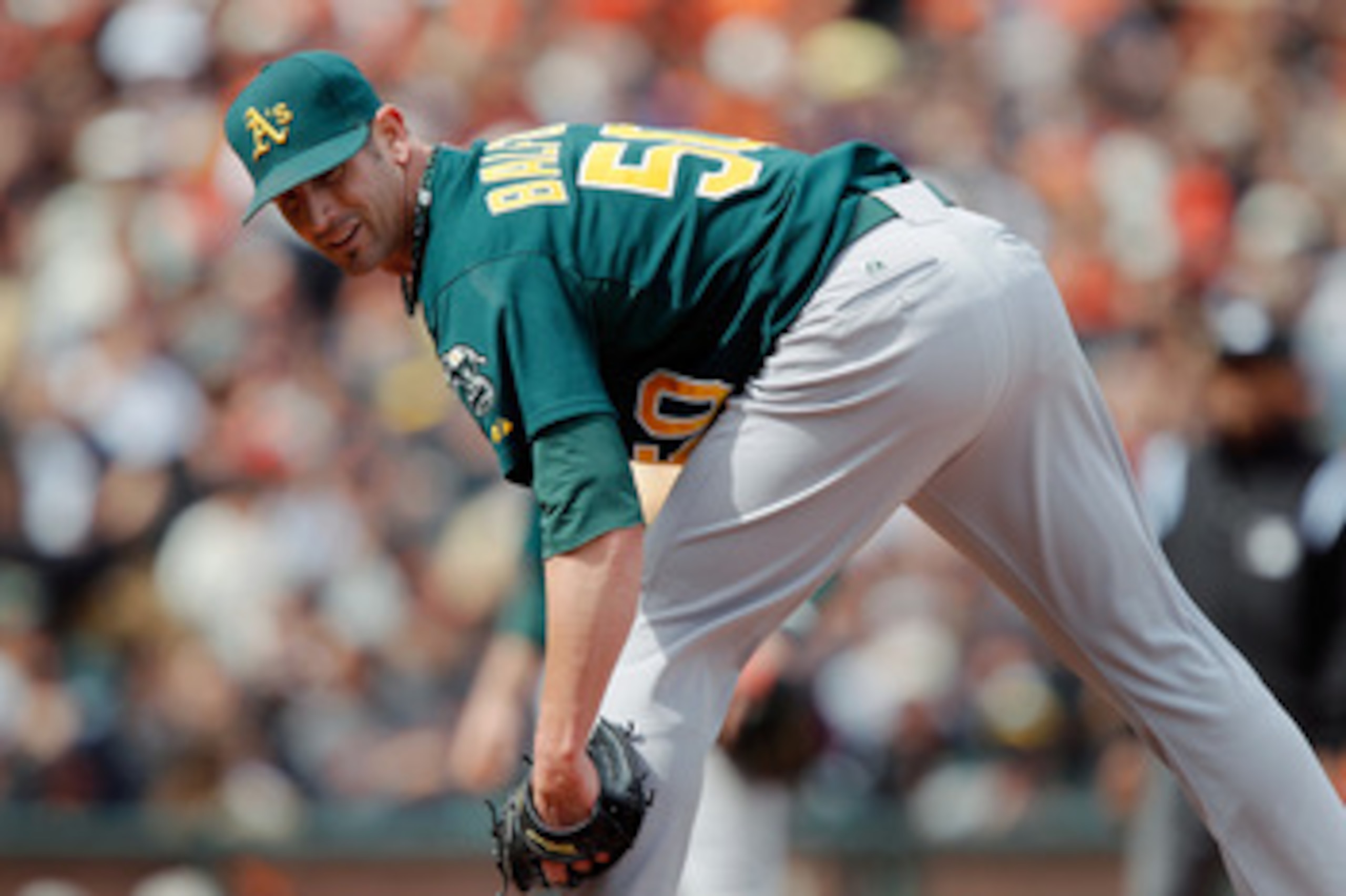 SAN FRANCISCO, CA - MAY 22:  Grant Balfour #50 of the Oakland A's looks to first base before throwing a pitch against the San Francisco Giants at AT&T Park on May 22, 2011 in San Francisco, California.  The Giants won 5-4.  (Photo by Brian Bahr/Getty Imag