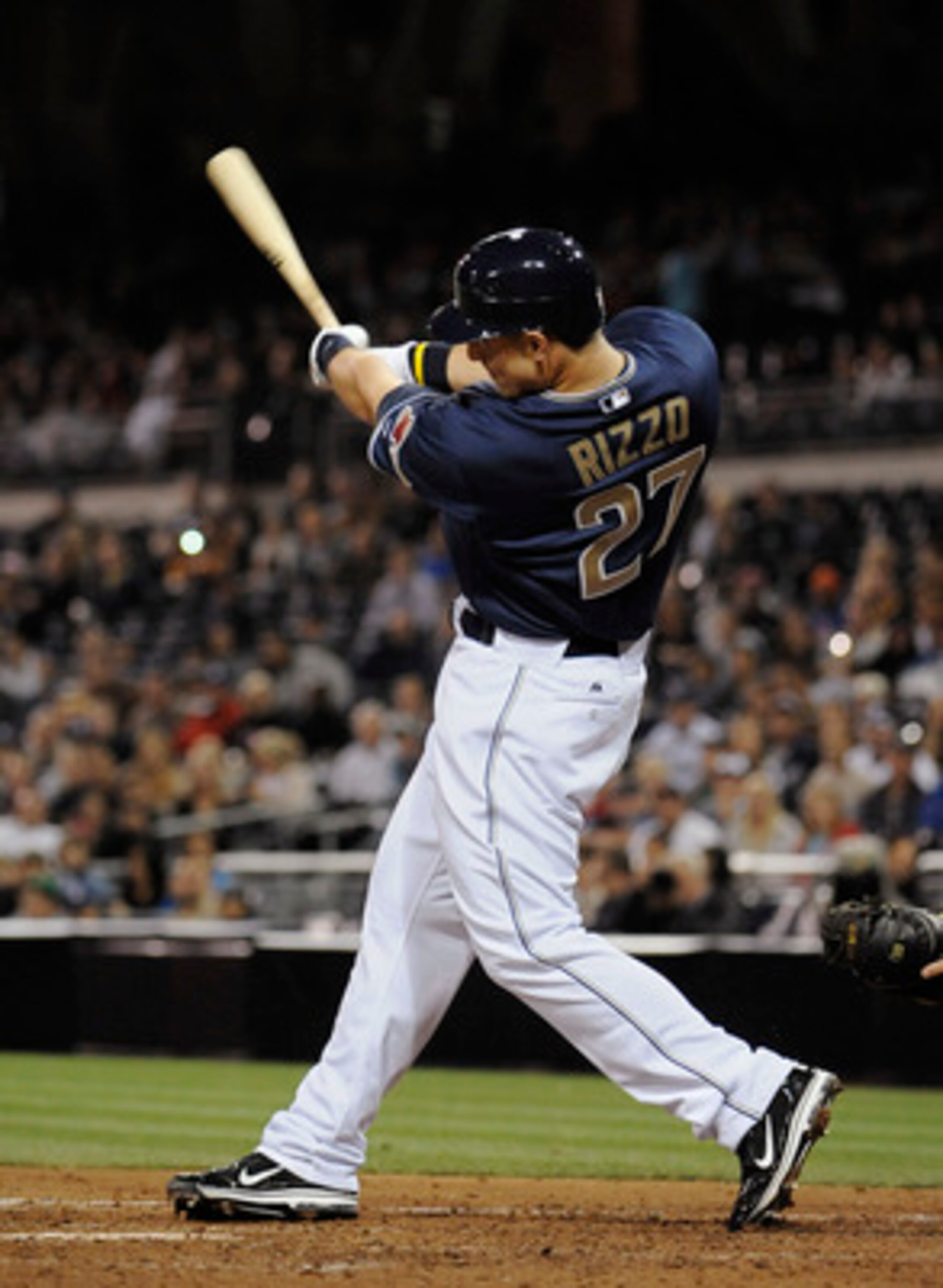 SAN DIEGO, CA - JUNE 9: Anthony Rizzo #27 of the San Diego Padres hits a triple during the fifth inning of a baseball game against the Washington Nationals at Petco Park on June 9, 2011 in San Diego, California.  (Photo by Denis Poroy/Getty Images)