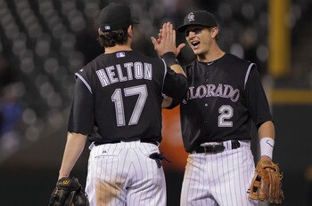 DENVER, CO - JUNE 09:  Todd Helton #17 and Troy Tulowitzki #2 of the Colorado Rockies celebrate their 9-7 victory over the Los Angeles Dodgers at Coors Field on June 9, 2011 in Denver, Colorado.  (Photo by Doug Pensinger/Getty Images)
