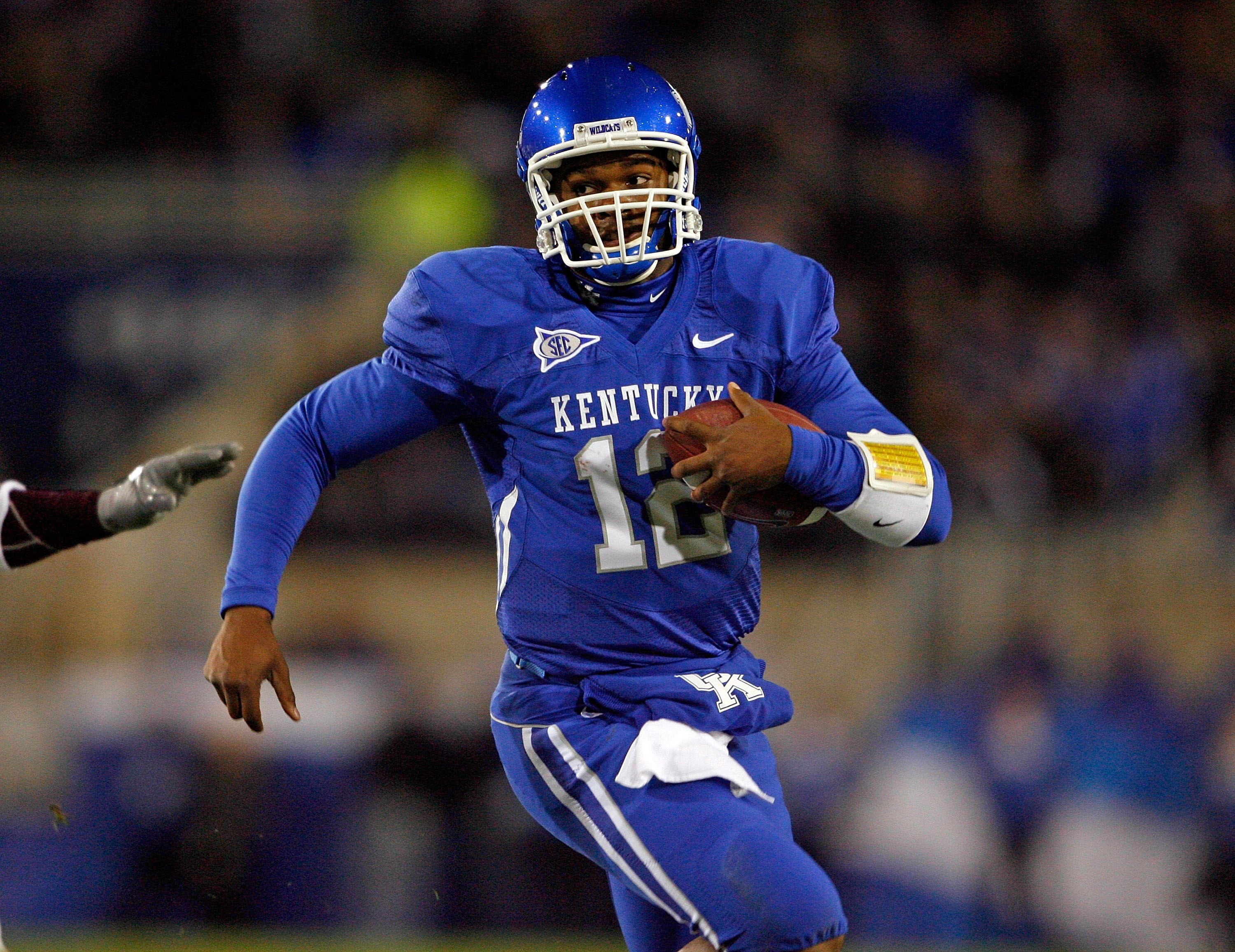 LEXINGTON, KY - OCTOBER 31:  Morgan Newton #12 of the Kentucky Wildcats runs with the ball during the SEC game against the Mississippi State Bulldogs at Commonwealth Stadium on October 31, 2009 in Lexington, Kentucky.  (Photo by Andy Lyons/Getty Images)