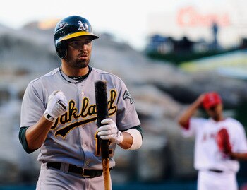 ANAHEIM, CA - MAY 25:  David DeJesus #12 of the Oakland Athletics at bat against the Los Angeles Angels of Anaheim during the baseball game at Angel Stadium of Anaheim on May 25, 2011 in Anaheim, California.  (Photo by Kevork Djansezian/Getty Images)