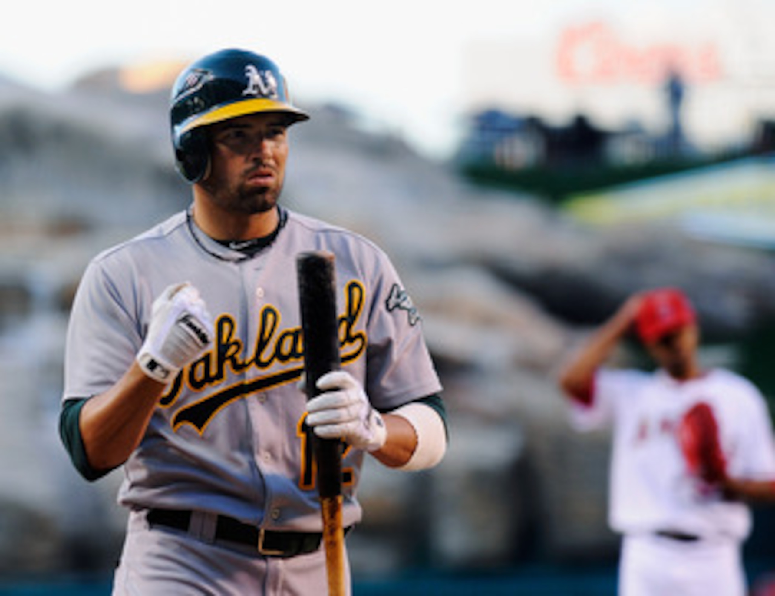ANAHEIM, CA - MAY 25:  David DeJesus #12 of the Oakland Athletics at bat against the Los Angeles Angels of Anaheim during the baseball game at Angel Stadium of Anaheim on May 25, 2011 in Anaheim, California.  (Photo by Kevork Djansezian/Getty Images)