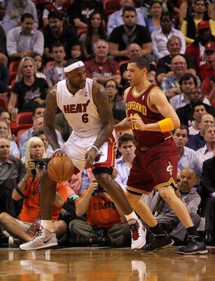 MIAMI, FL - JANUARY 31:  LeBron James #6 of the Miami Heat posts up Anthony Parker #18 of the Cleveland Cavaliers during a game at American Airlines Arena on January 31, 2011 in Miami, Florida. NOTE TO USER: User expressly acknowledges and agrees that, by