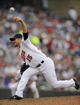 MINNEAPOLIS, MN - APRIL 10: Glen Perkins #15 of the Minnesota Twins pitches against the Oakland Athletics during the sixth inning of their game on April 10, 2011 at Target Field in Minneapolis, Minnesota. Athletics defeated the Twins 5-3. (Photo by Hannah