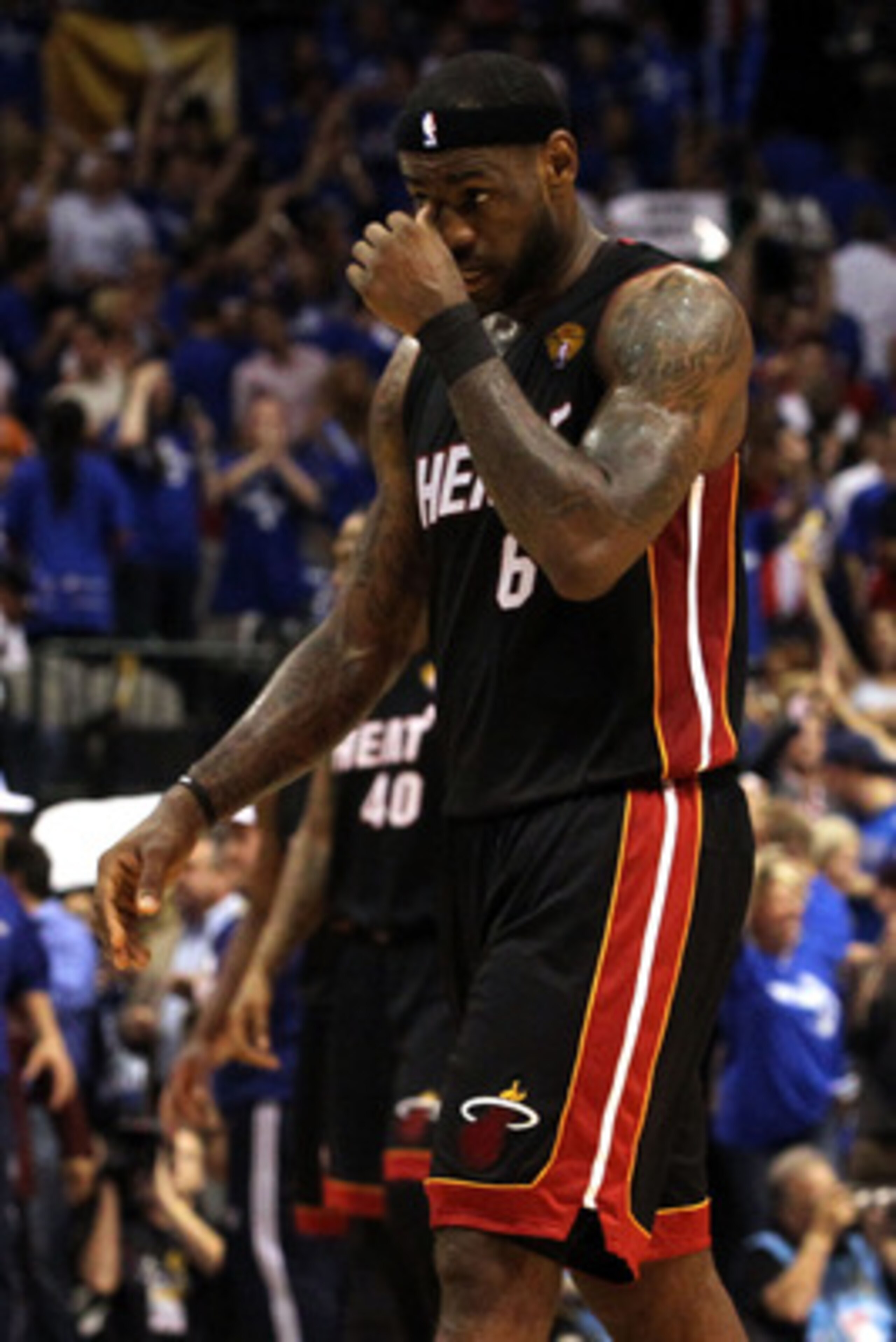 DALLAS, TX - JUNE 09: LeBron James #6 of the Miami Heat looks on against the Dallas Mavericks in Game Five of the 2011 NBA Finals at American Airlines Center on June 9, 2011 in Dallas, Texas. NOTE TO USER: User expressly acknowledges and agrees that, by DALLAS, TX - JUNE 09: LeBron James #6 of the Miami Heat looks on against the Dallas Mavericks in Game Five of the 2011 NBA Finals at American Airlines Center on June 9, 2011 in Dallas, Texas. NOTE TO USER: User expressly acknowledges and agrees that, by