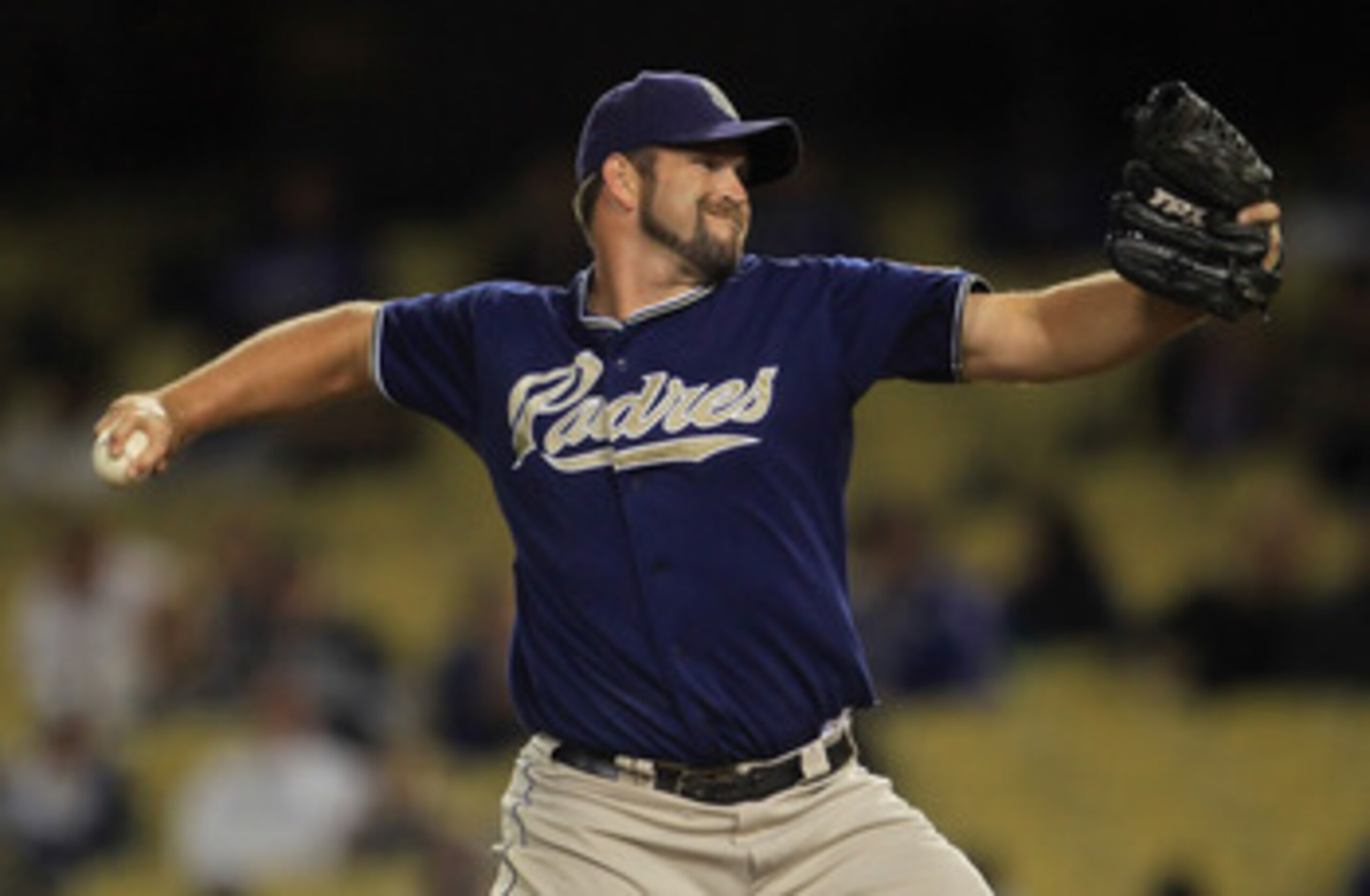 LOS ANGELES, CA - SEPTEMBER 22:  Heath Bell #21 of the San Diego Padres pitches against the Los Angeles Dodgers in the ninth inning at Dodger Stadium on September 22, 2010 in Los Angeles, California.  The Padres defeated the Dodgers 3-1.  (Photo by Jeff G