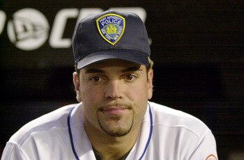 394801 04: Catcher Mike Piazza of the New York Mets wears a Port Authority Police hat in honor of the dead and missing emergency personnel before the Mets'' game against the Atlanta Braves at Shea Stadium in Flushing, NY September 21, 2001 in the first ma 394801 04: Catcher Mike Piazza of the New York Mets wears a Port Authority Police hat in honor of the dead and missing emergency personnel before the Mets'' game against the Atlanta Braves at Shea Stadium in Flushing, NY September 21, 2001 in the first ma