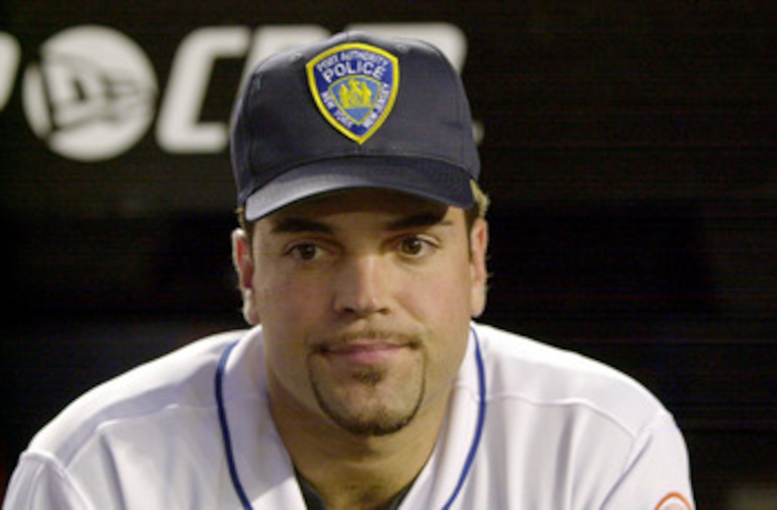 394801 04: Catcher Mike Piazza of the New York Mets wears a Port Authority Police hat in honor of the dead and missing emergency personnel before the Mets'' game against the Atlanta Braves at Shea Stadium in Flushing, NY September 21, 2001 in the first ma